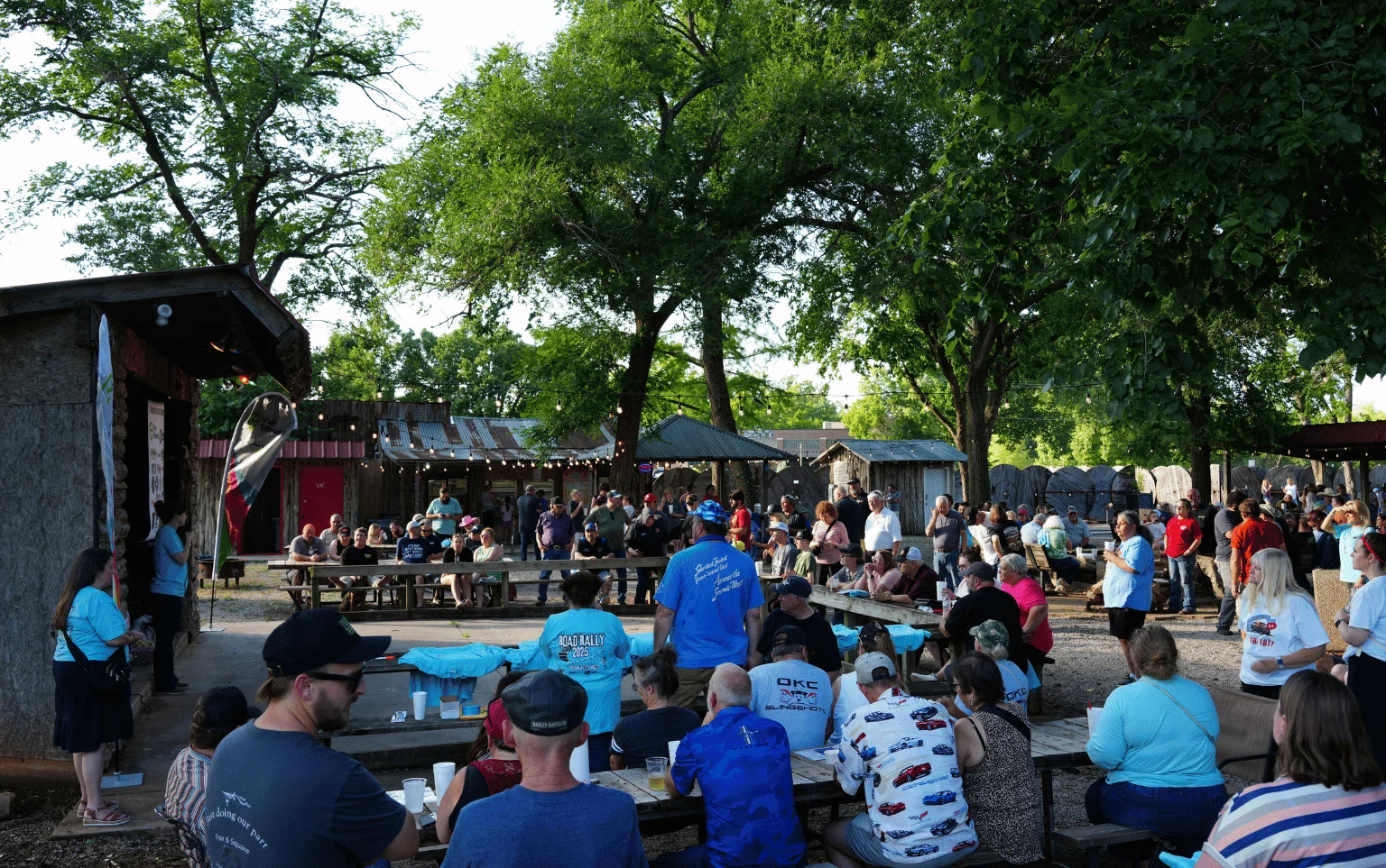 Outdoor dining area filled with guests enjoying a lively atmosphere