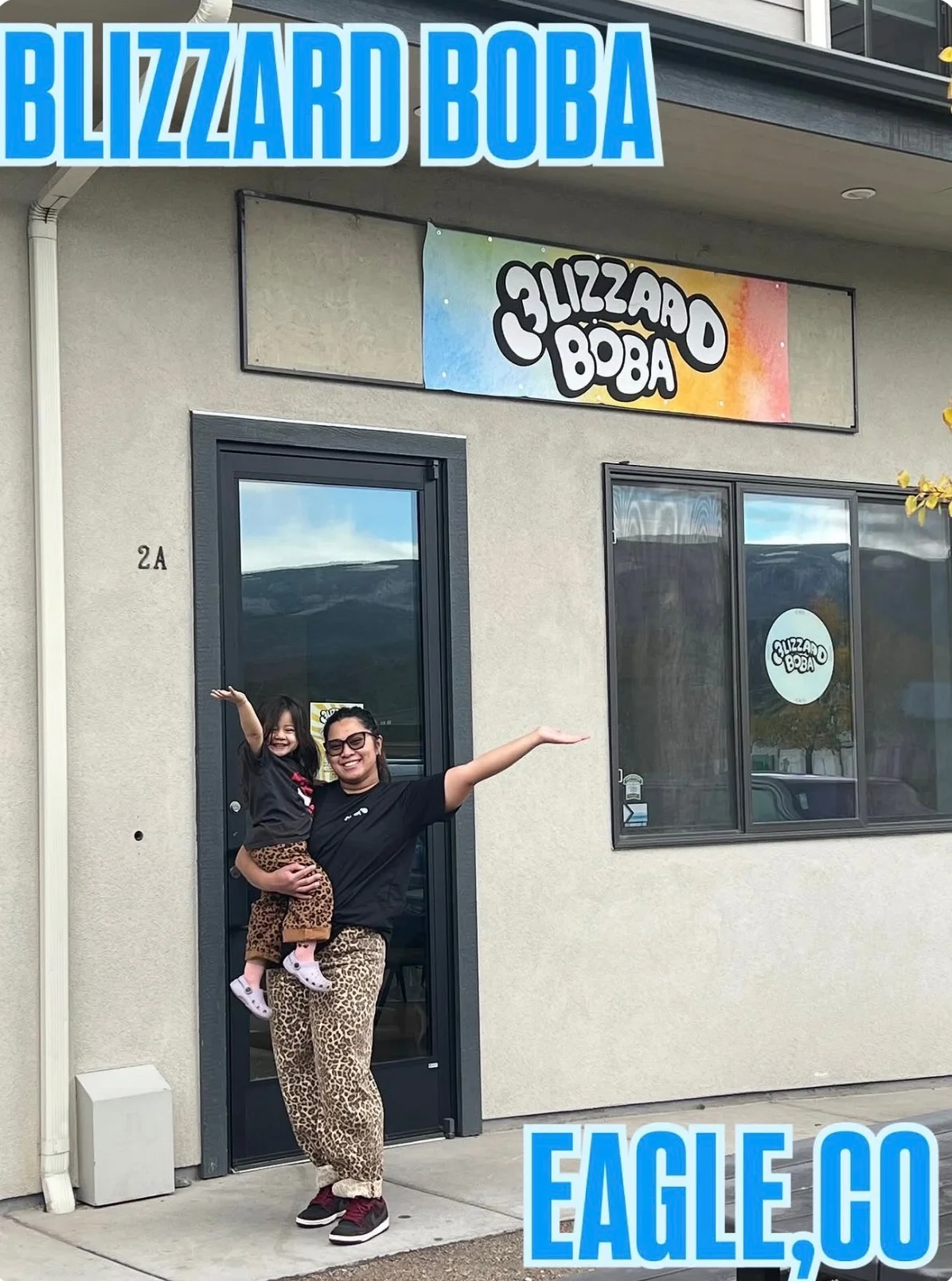 Blizzard Boba storefront with parent and child posing outside