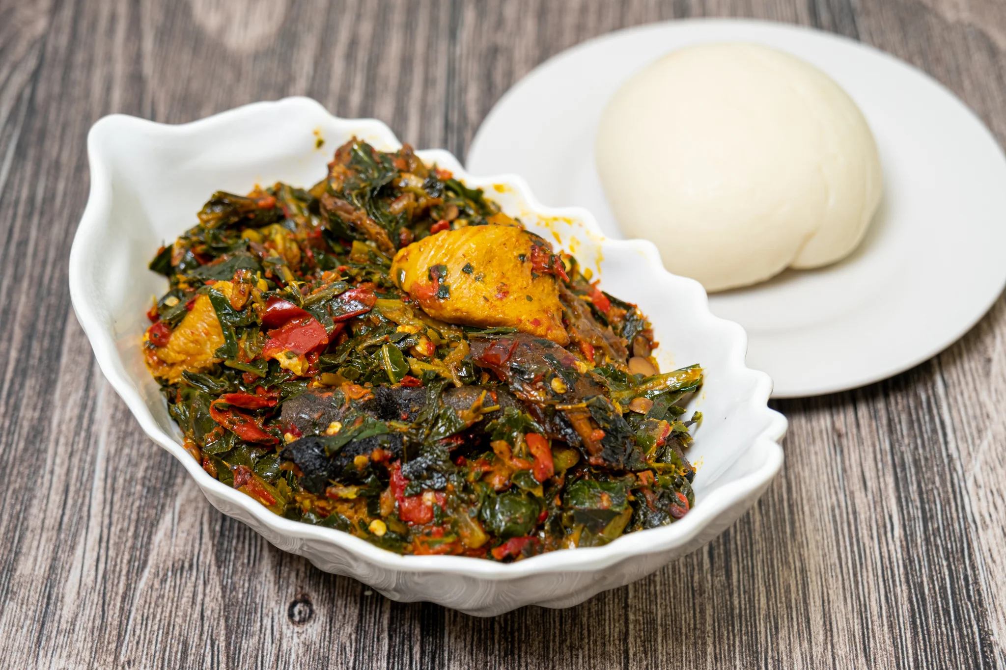 Nigerian egusi soup served with fufu