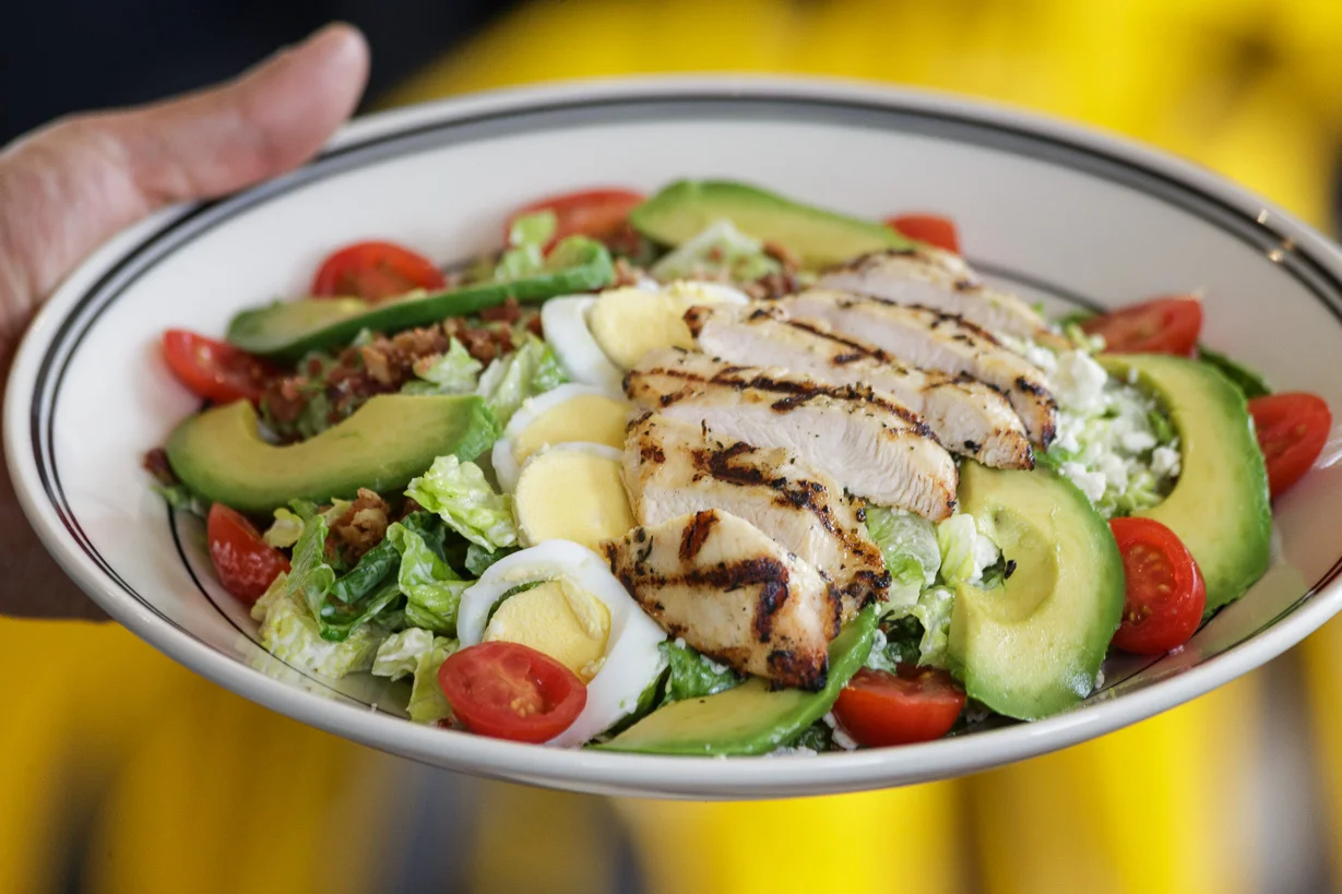 Grilled chicken salad with avocado and cherry tomatoes