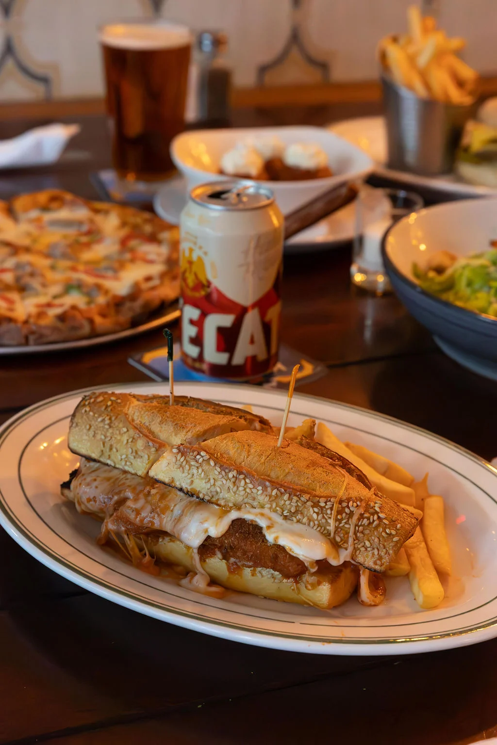 Loaded Mexican torta with fries and beer