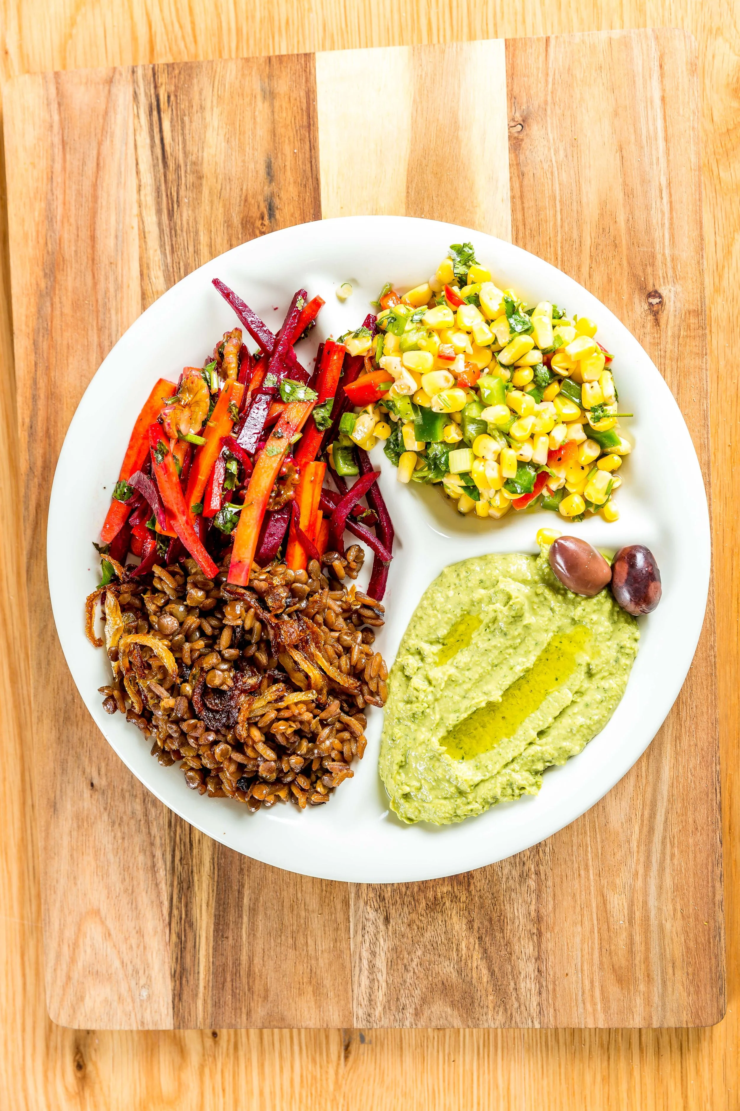 Colorful Mediterranean grain bowl with lentils and fresh vegetables