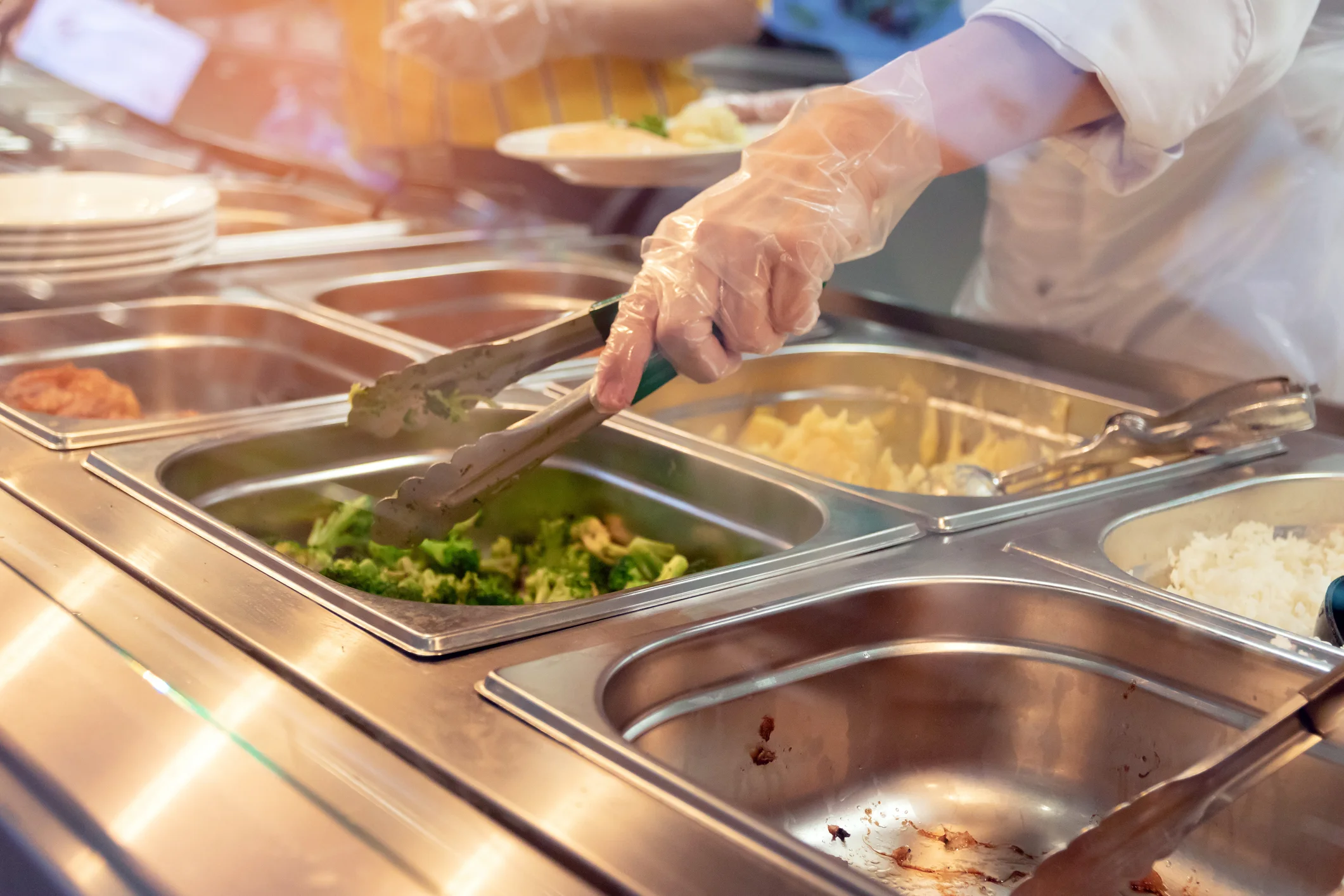 Serving fresh vegetables in a buffet-style restaurant