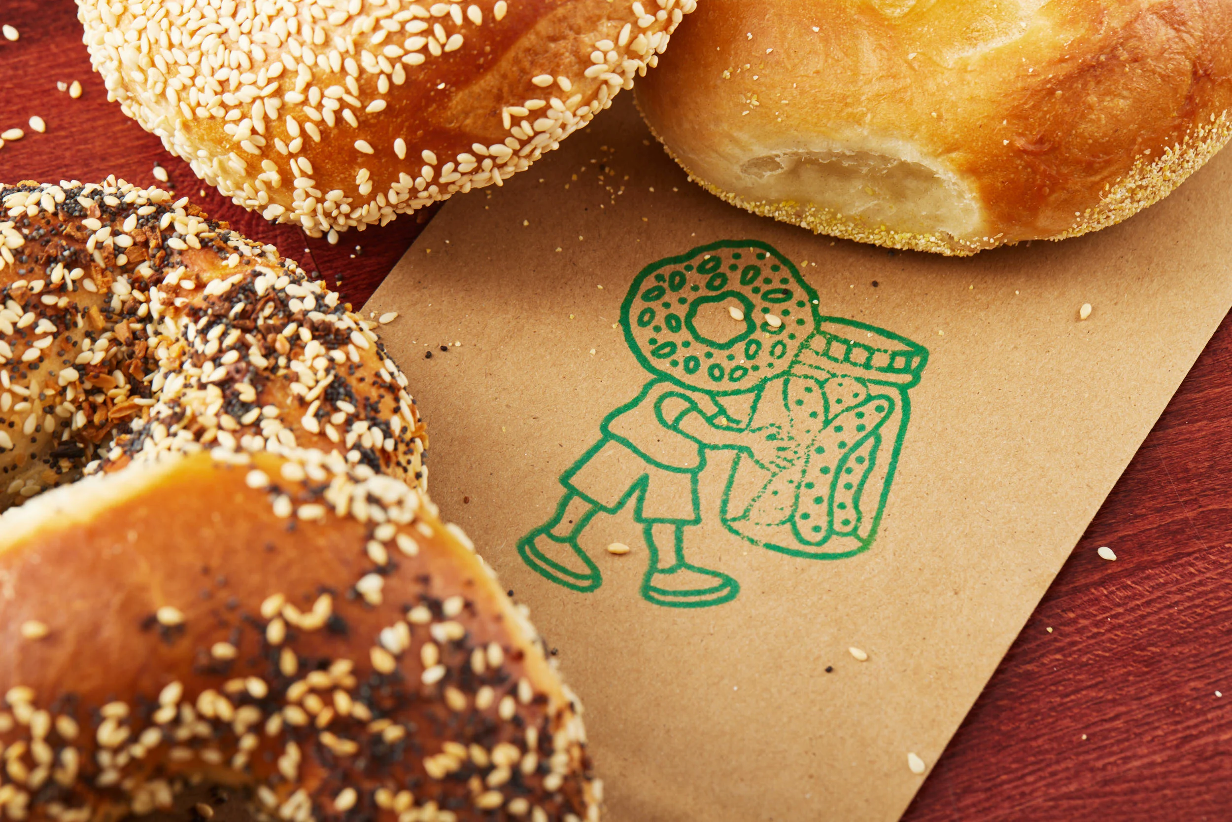 Freshly baked bagels with sesame seeds on a rustic table