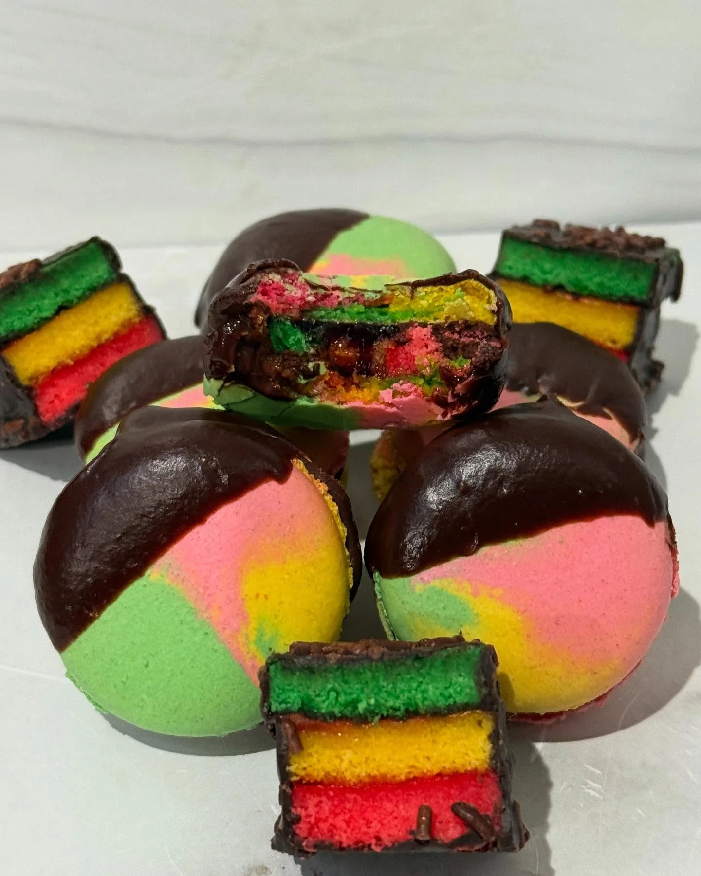Colorful Jamaican rainbow cake with chocolate coating
