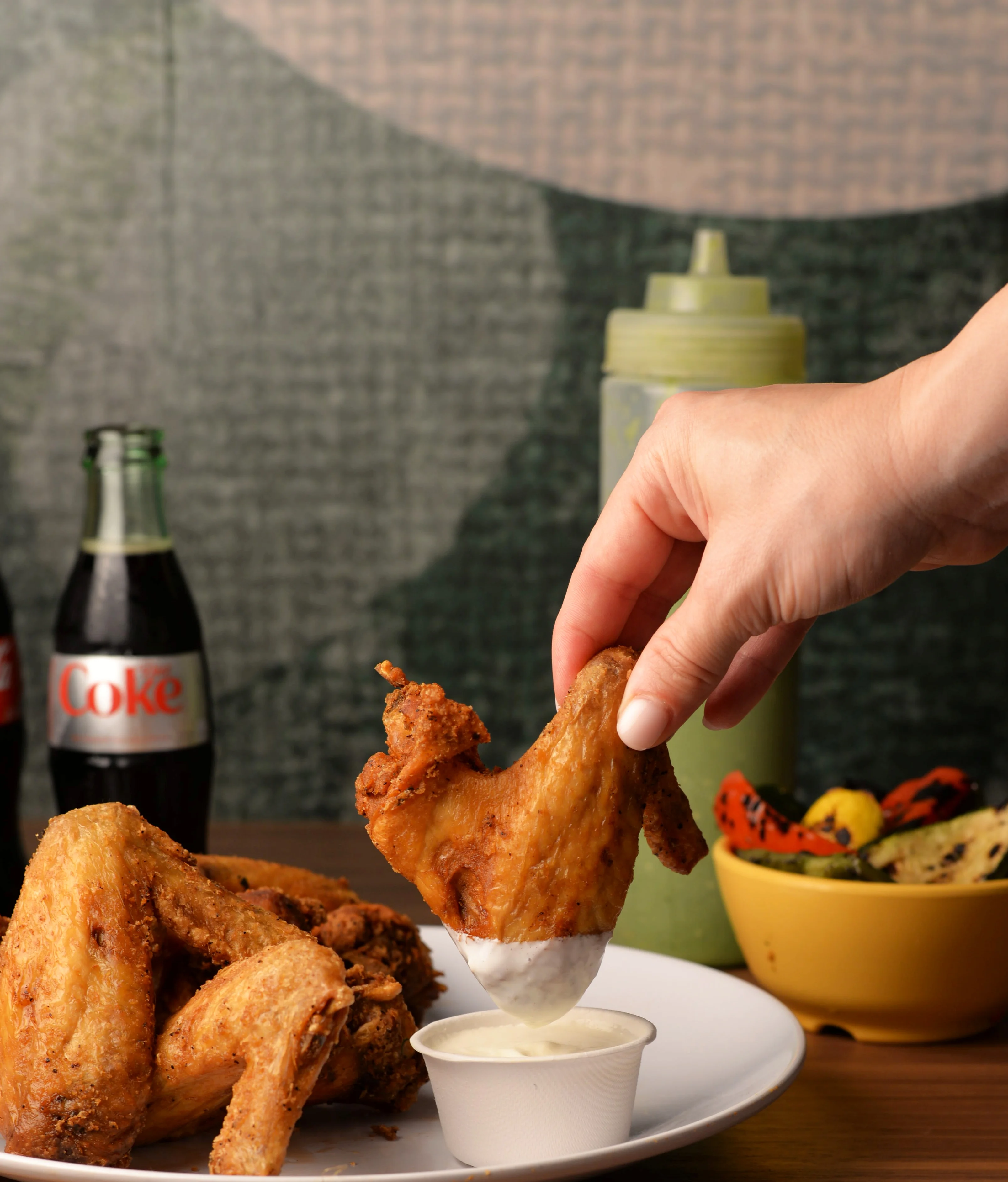 Crispy fried chicken wings with dipping sauce