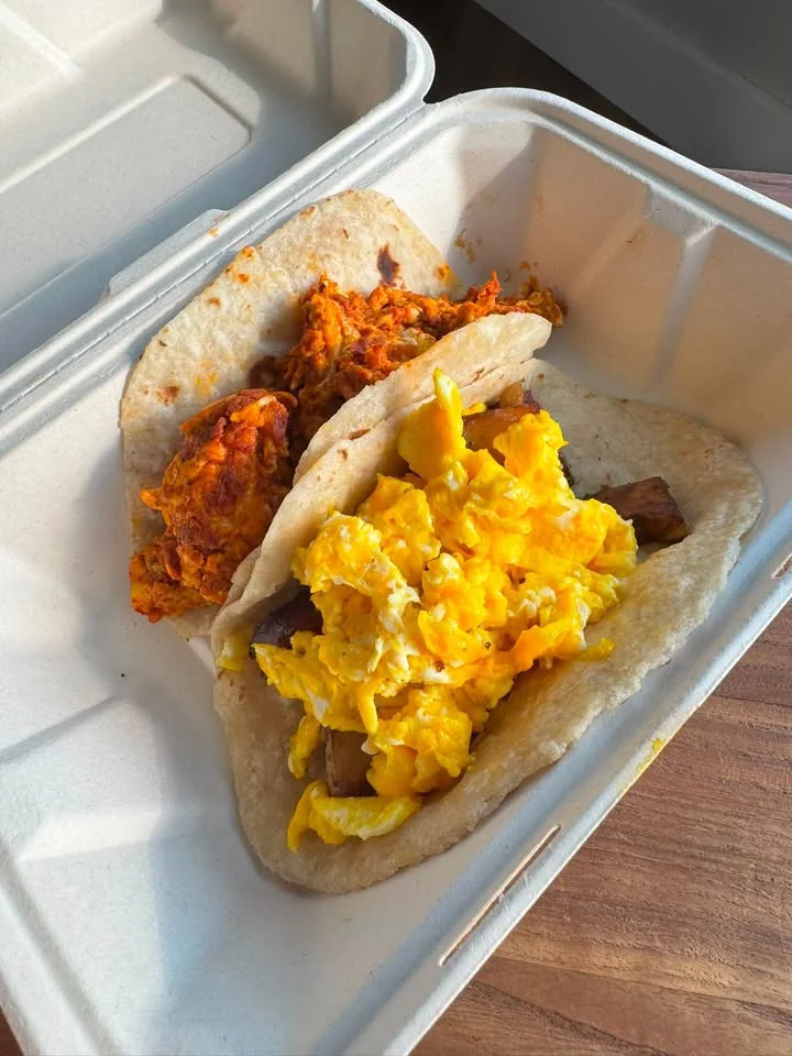 Delicious breakfast tacos with scrambled eggs and spicy chicken