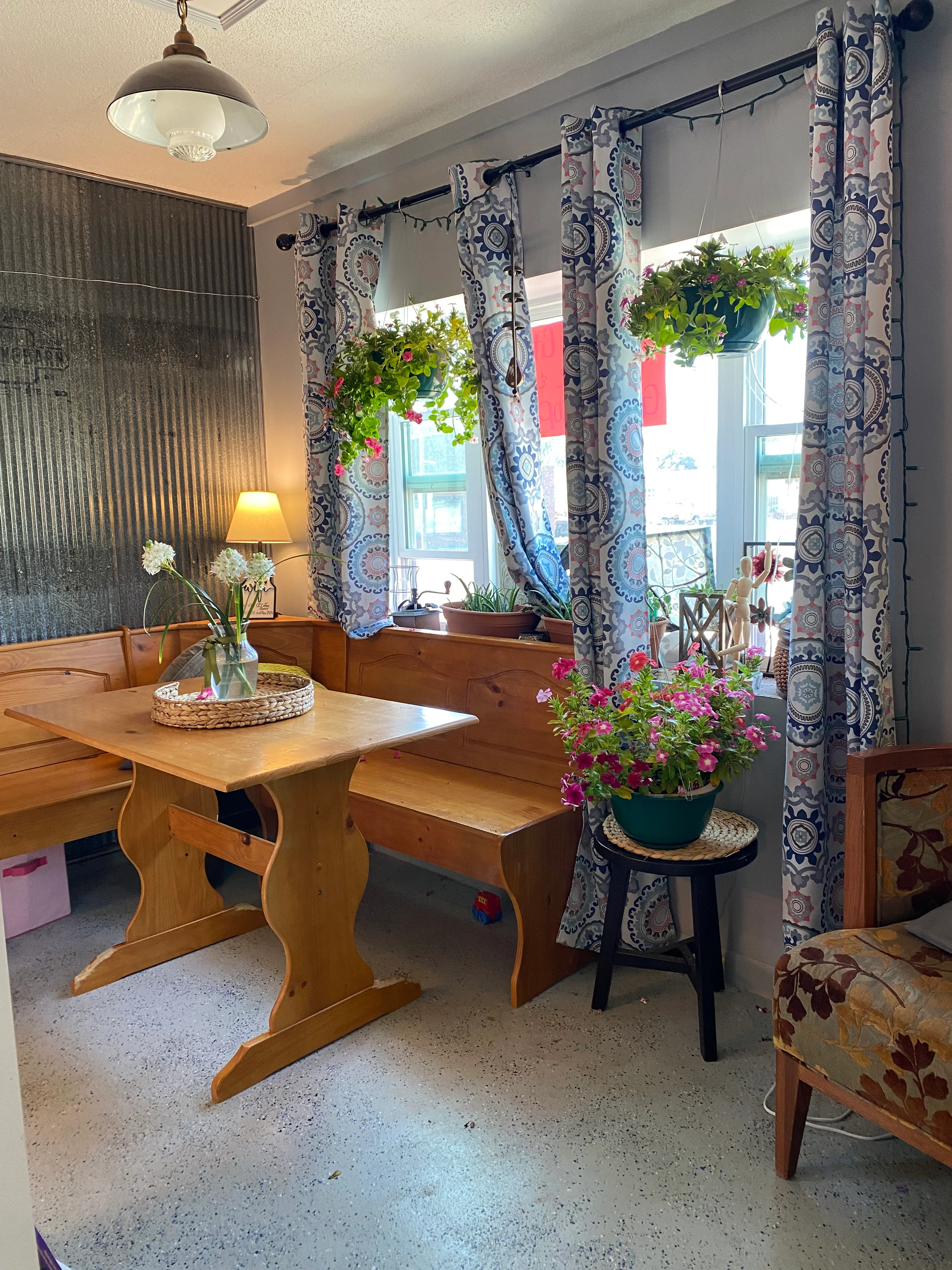 Cozy dining nook with wooden table and floral decor