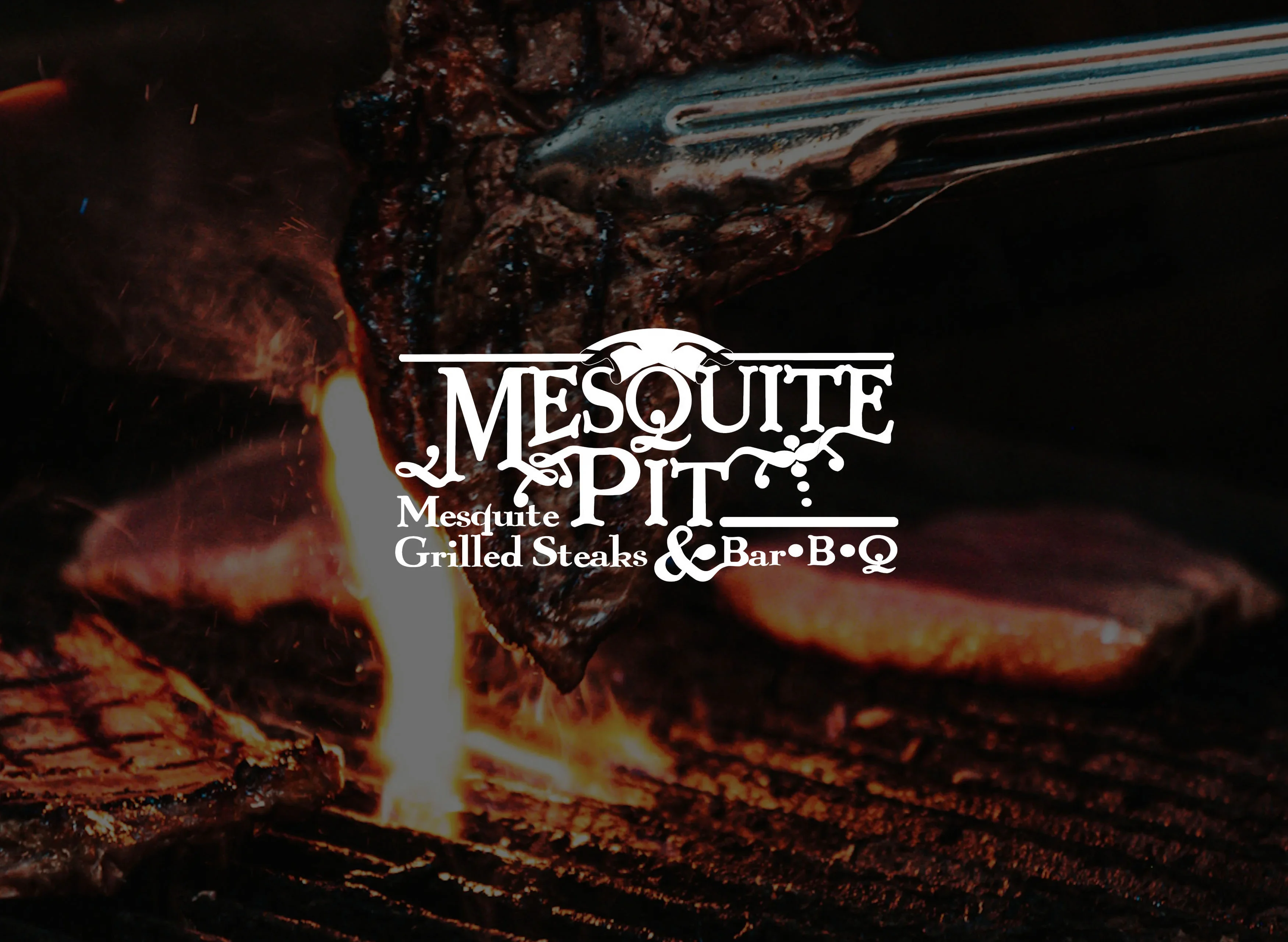 Grilled steak over an open flame at a barbecue restaurant