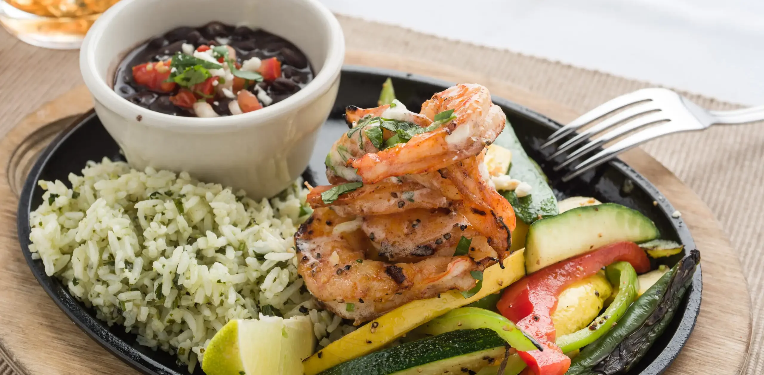 Grilled shrimp fajitas with rice and black beans