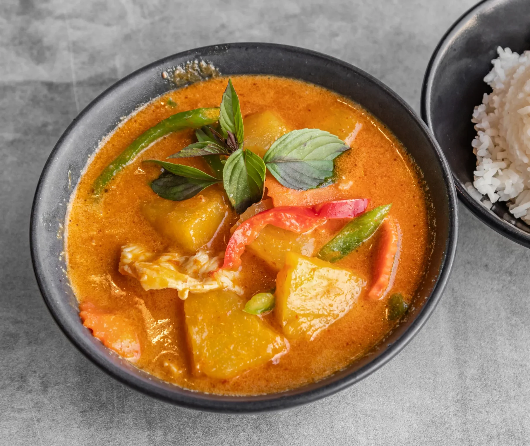 Delicious pineapple curry served in a bowl with vibrant colors.