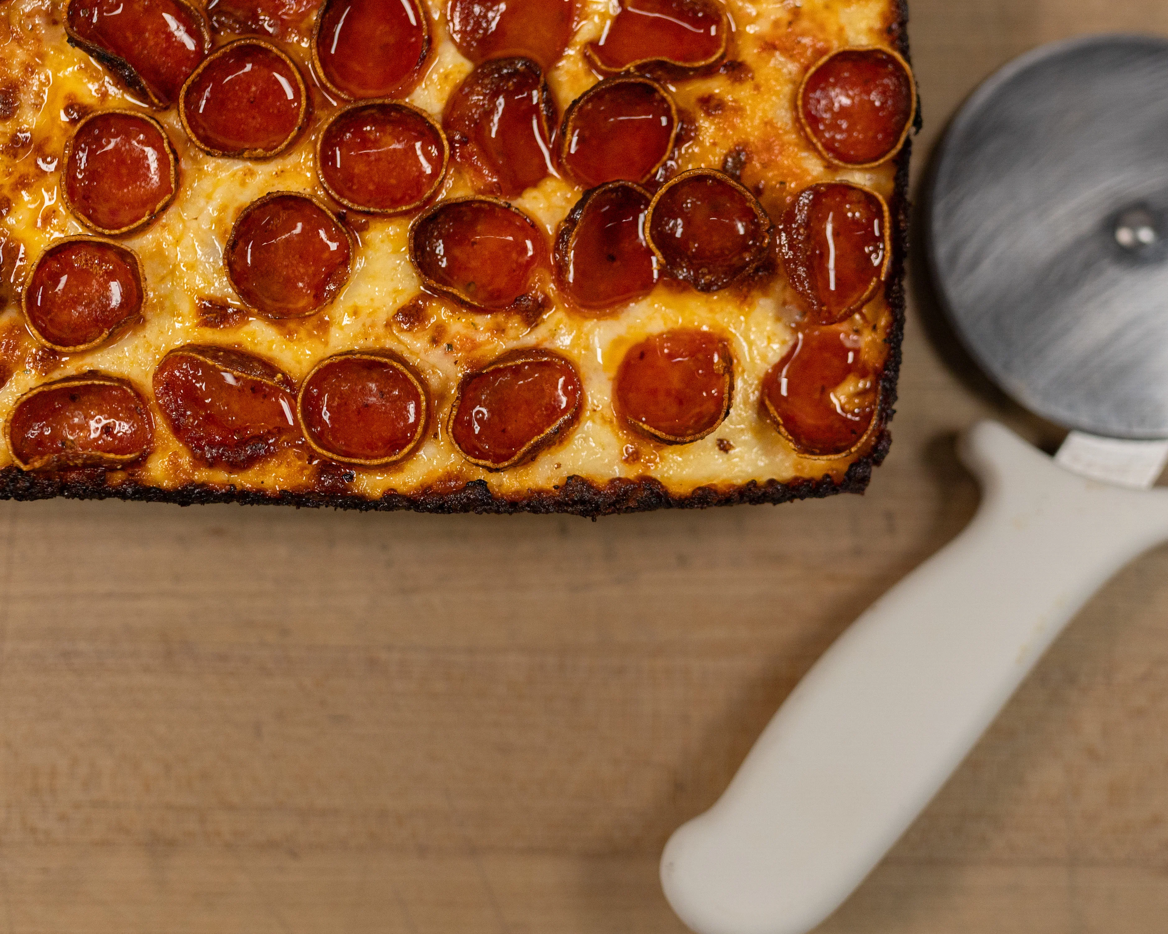 Detroit-style pepperoni pizza with crispy edges