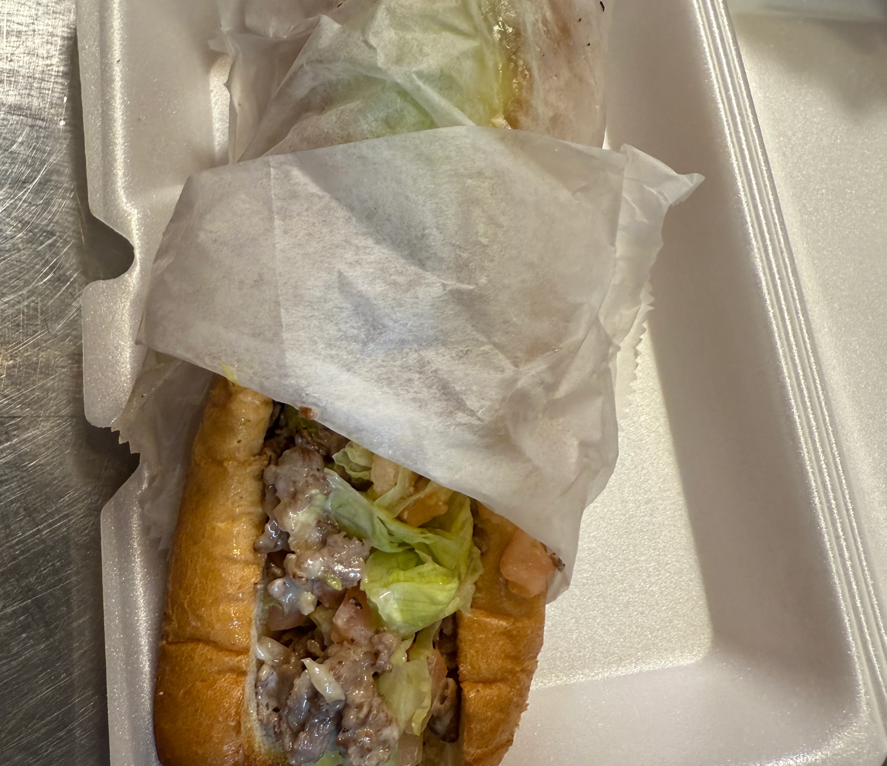 Delicious cheesesteak sandwich wrapped in paper