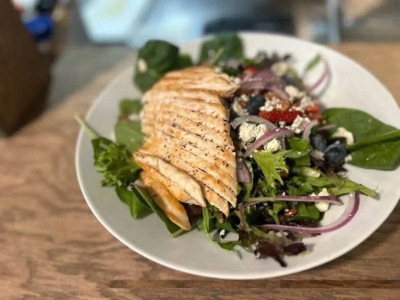 Grilled salmon salad with mixed greens