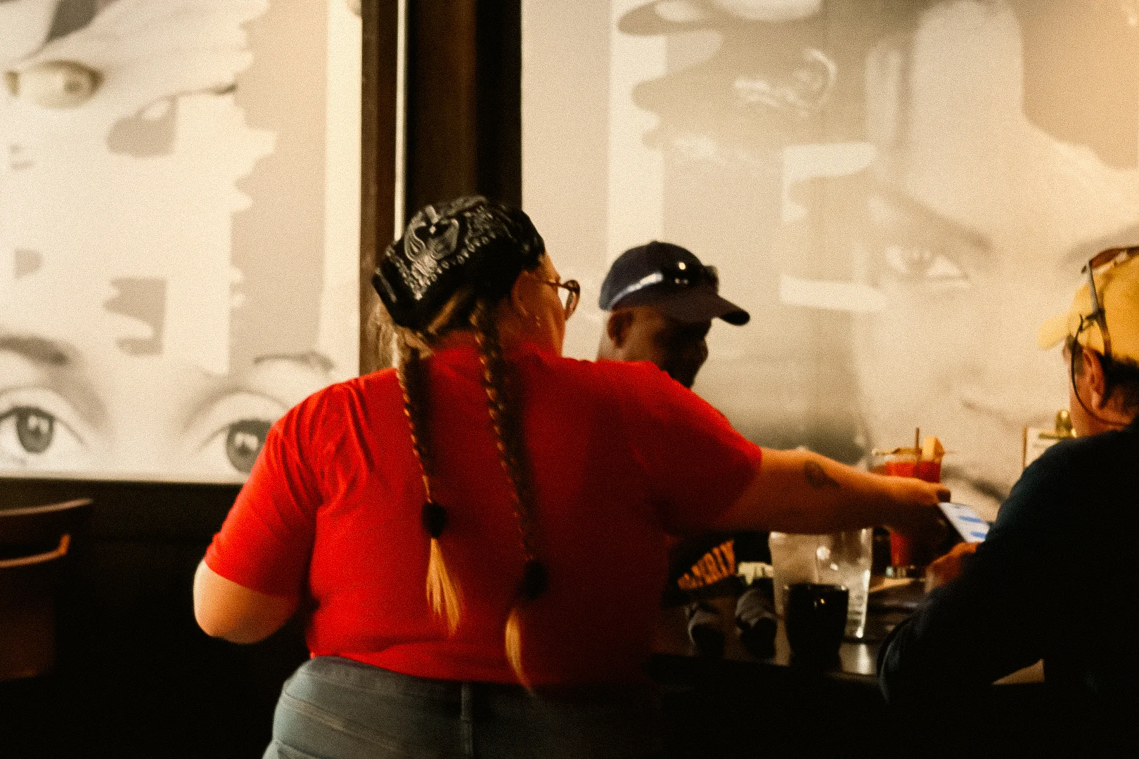 A server at a table on a husker game day
