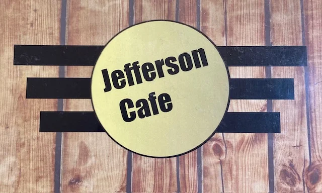 Jefferson Cafe logo on a rustic wooden background