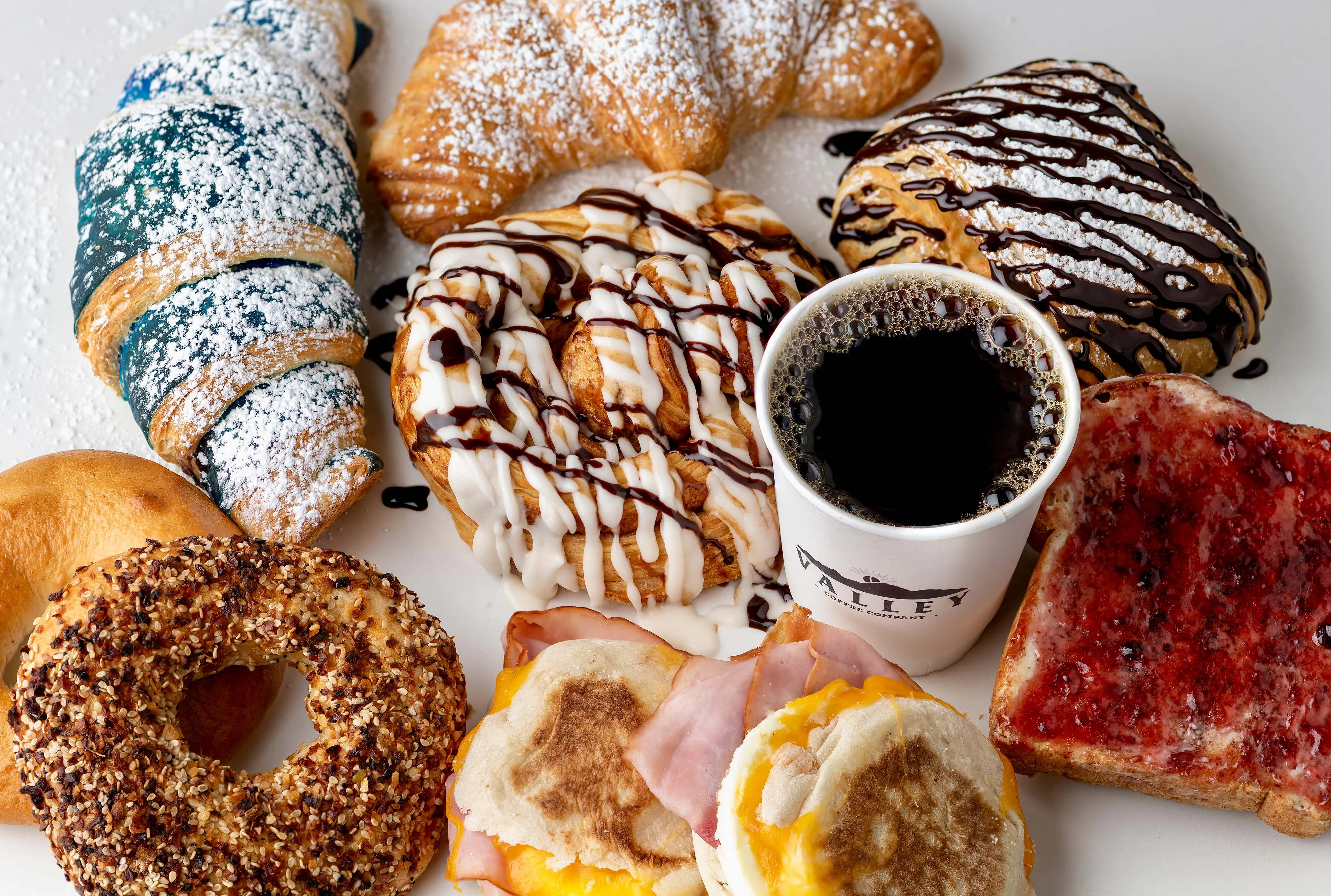 Assorted pastries and coffee in a cozy café setting