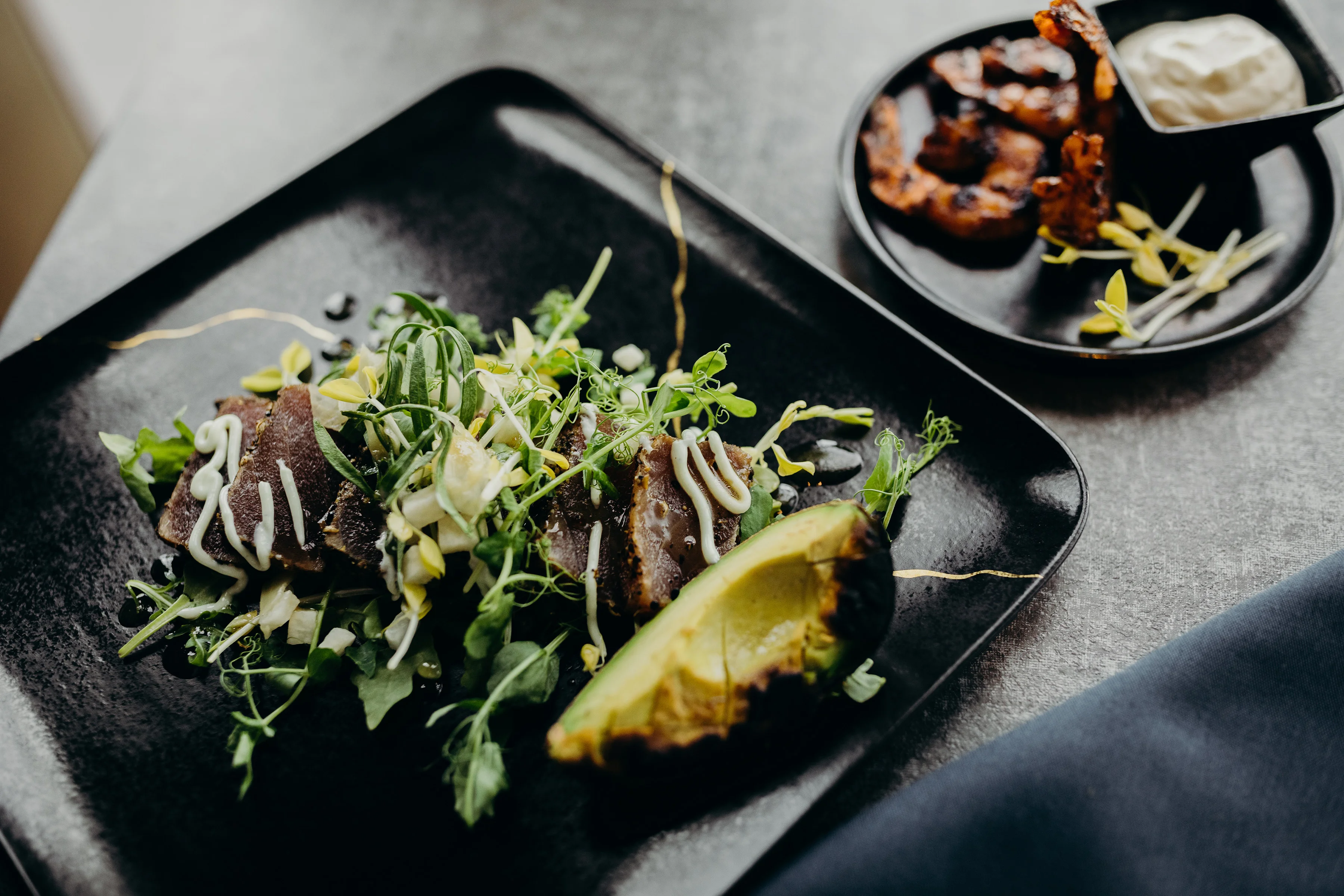 Seared tuna salad with avocado and microgreens