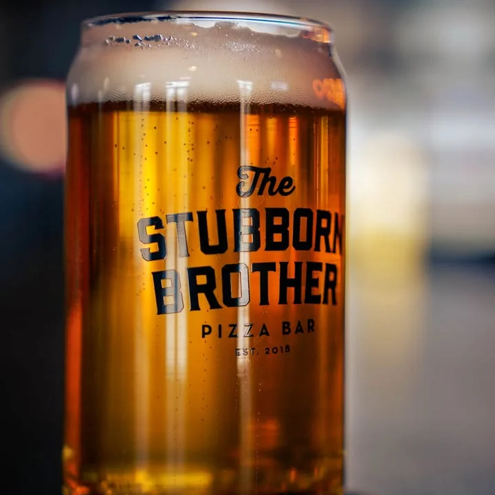 Craft beer in a glass at a pizza bar