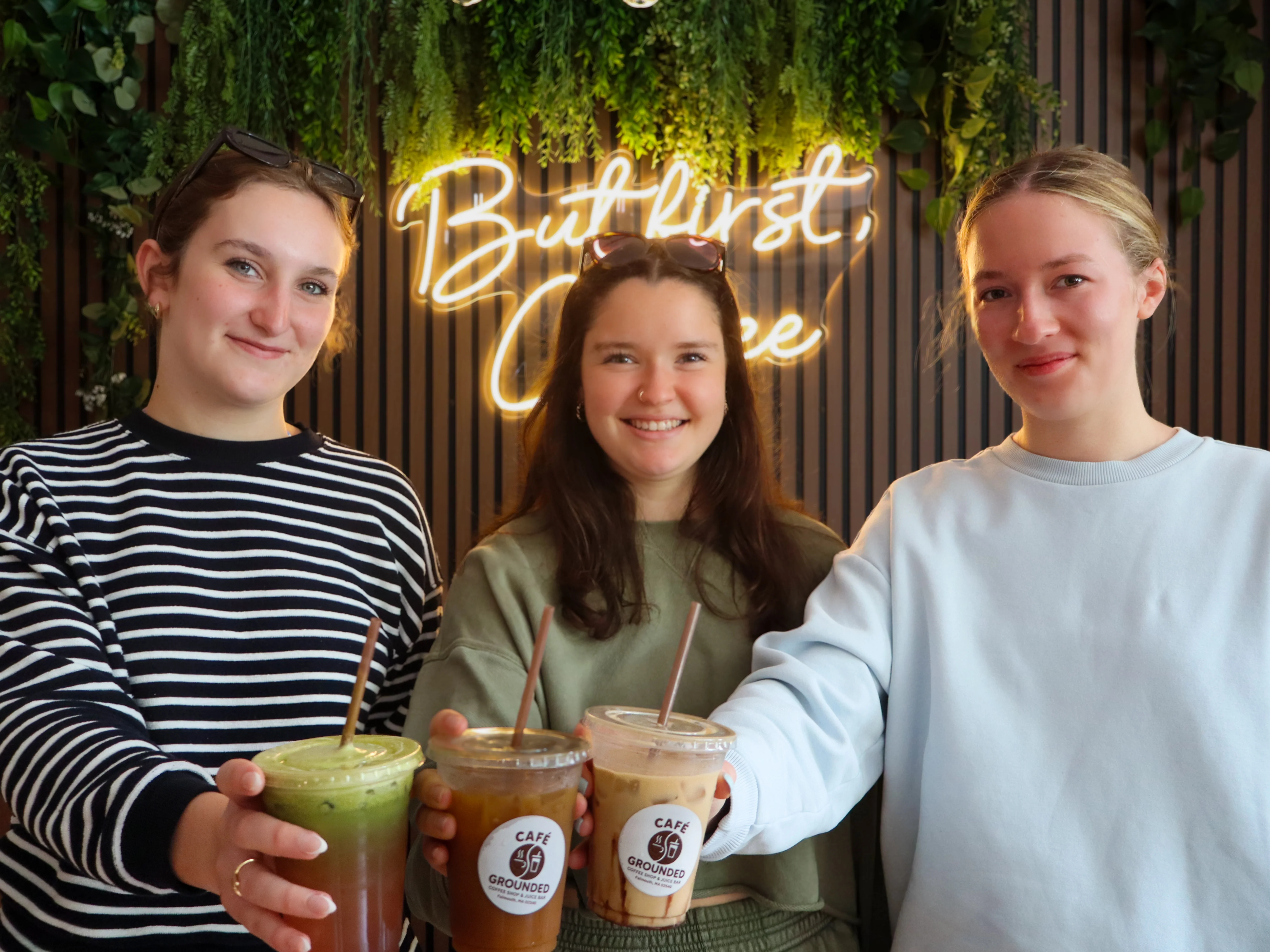 Assorted coffee drinks and almond croissant on a festive background