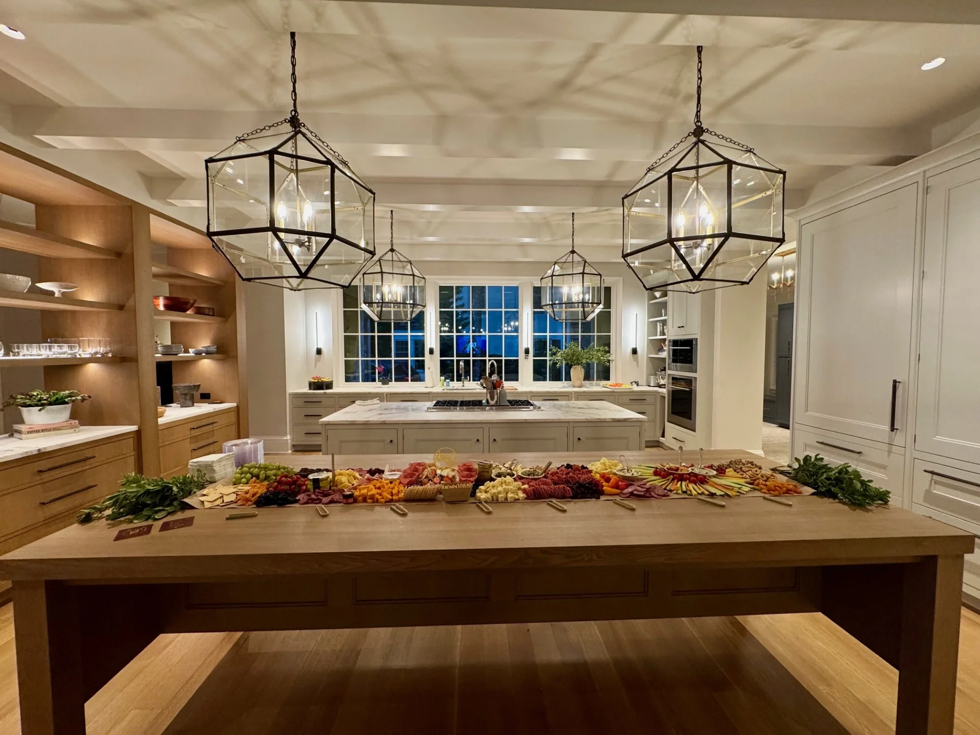 Elegant kitchen with a charcuterie spread on a wooden table