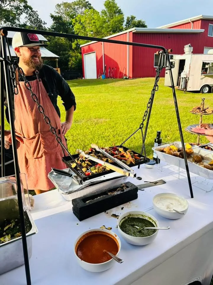 Grilled kebabs with vibrant vegetables at an outdoor event