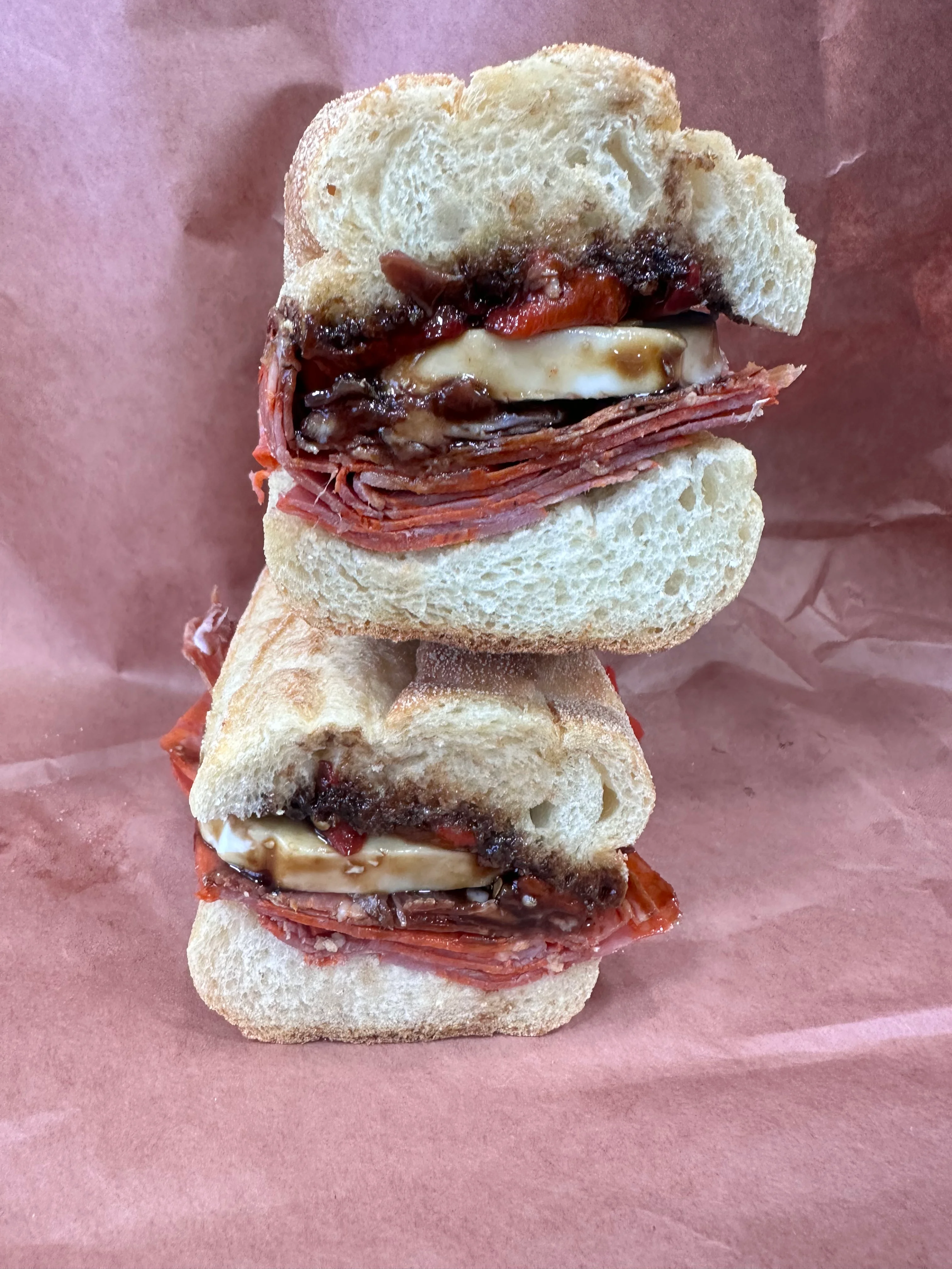 Italian deli sandwich with cured meats and cheese