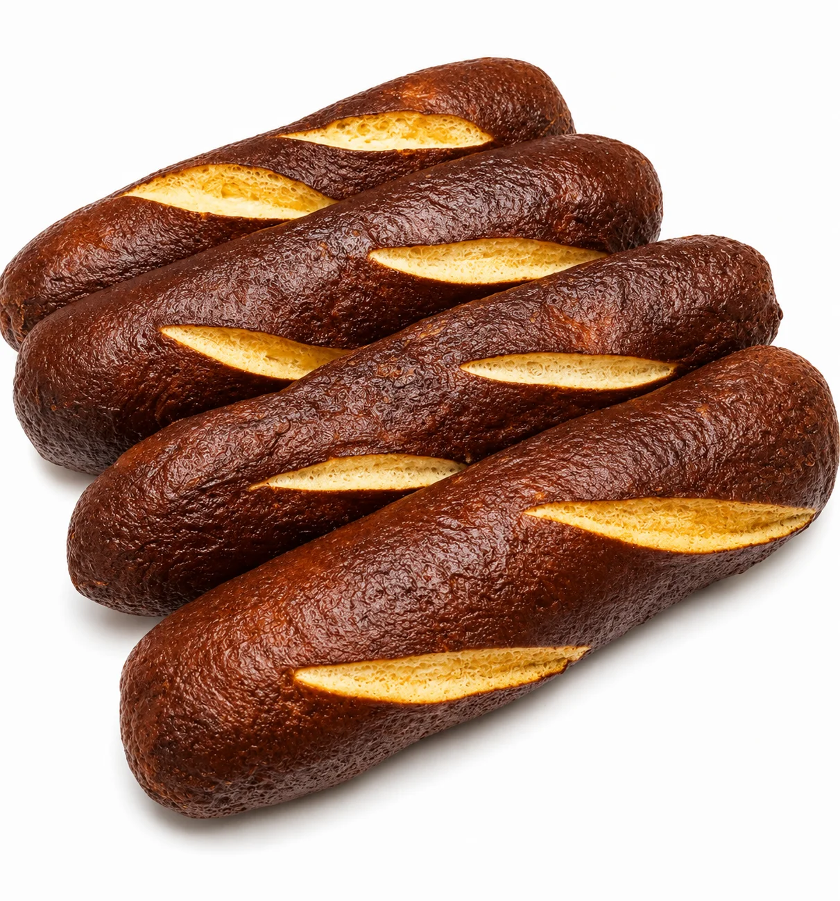 Four dark brown bread rolls with slits on top, arranged neatly.