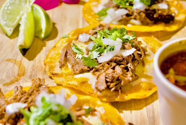 Authentic Mexican tacos with shredded beef and fresh toppings