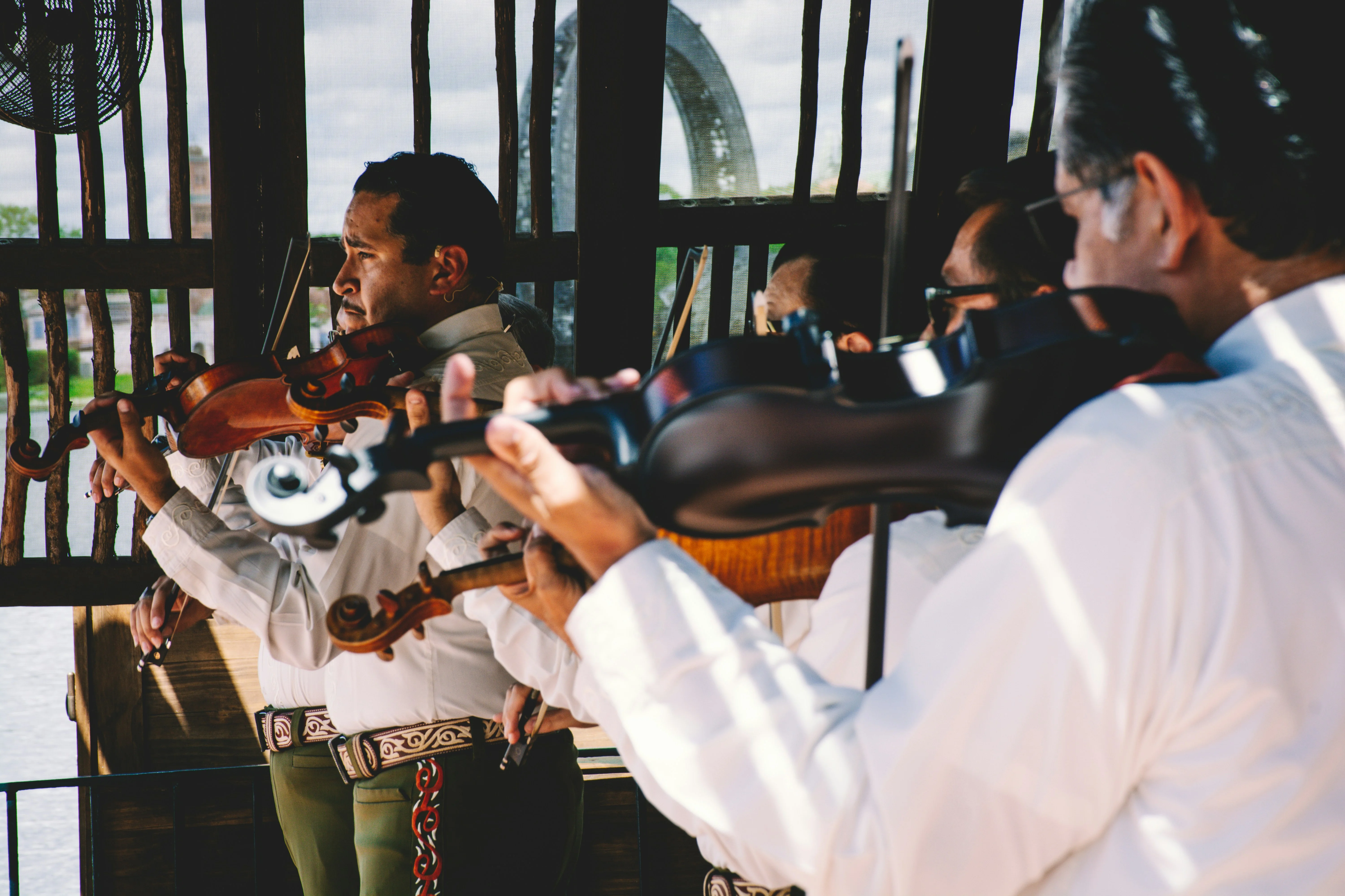 Mariachi musicians performing with violins