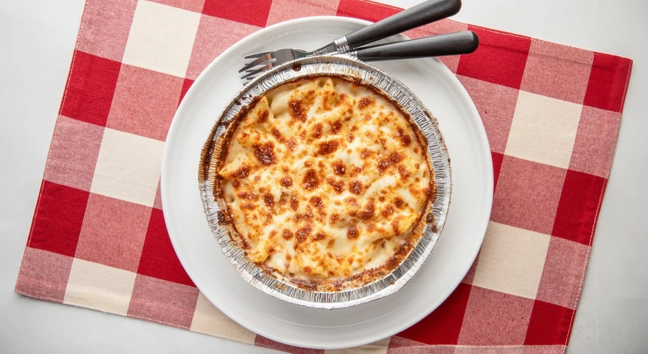 Baked lasagna served in a foil dish