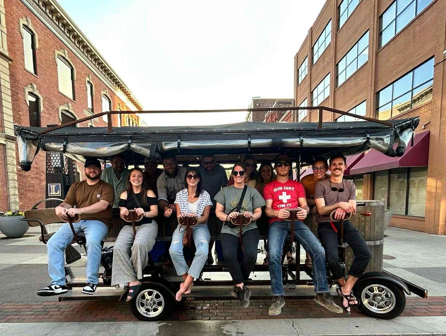 Group enjoying a fun ride on a pedal-powered party bike