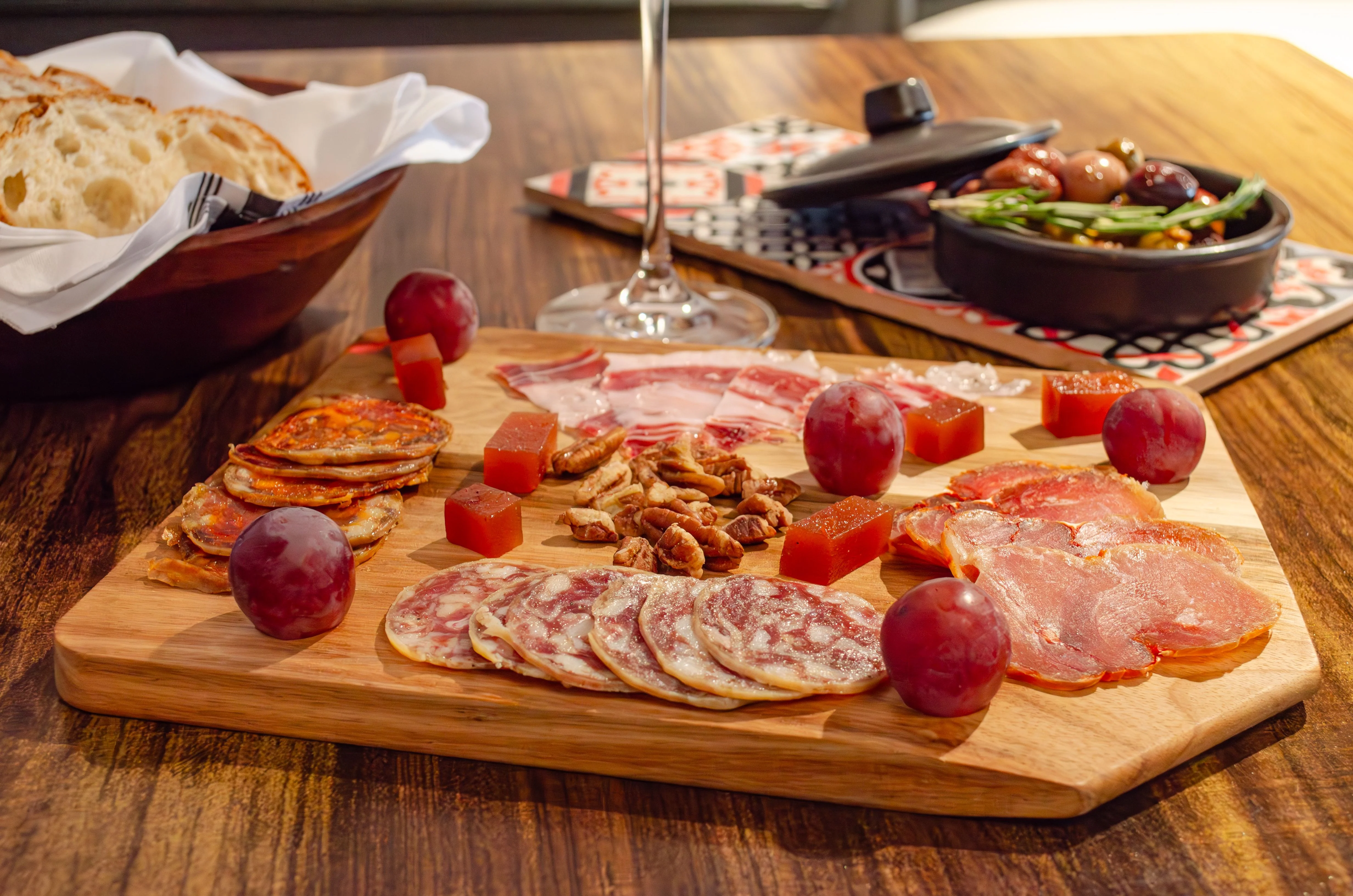 Charcuterie board featuring assorted meats and accompaniments