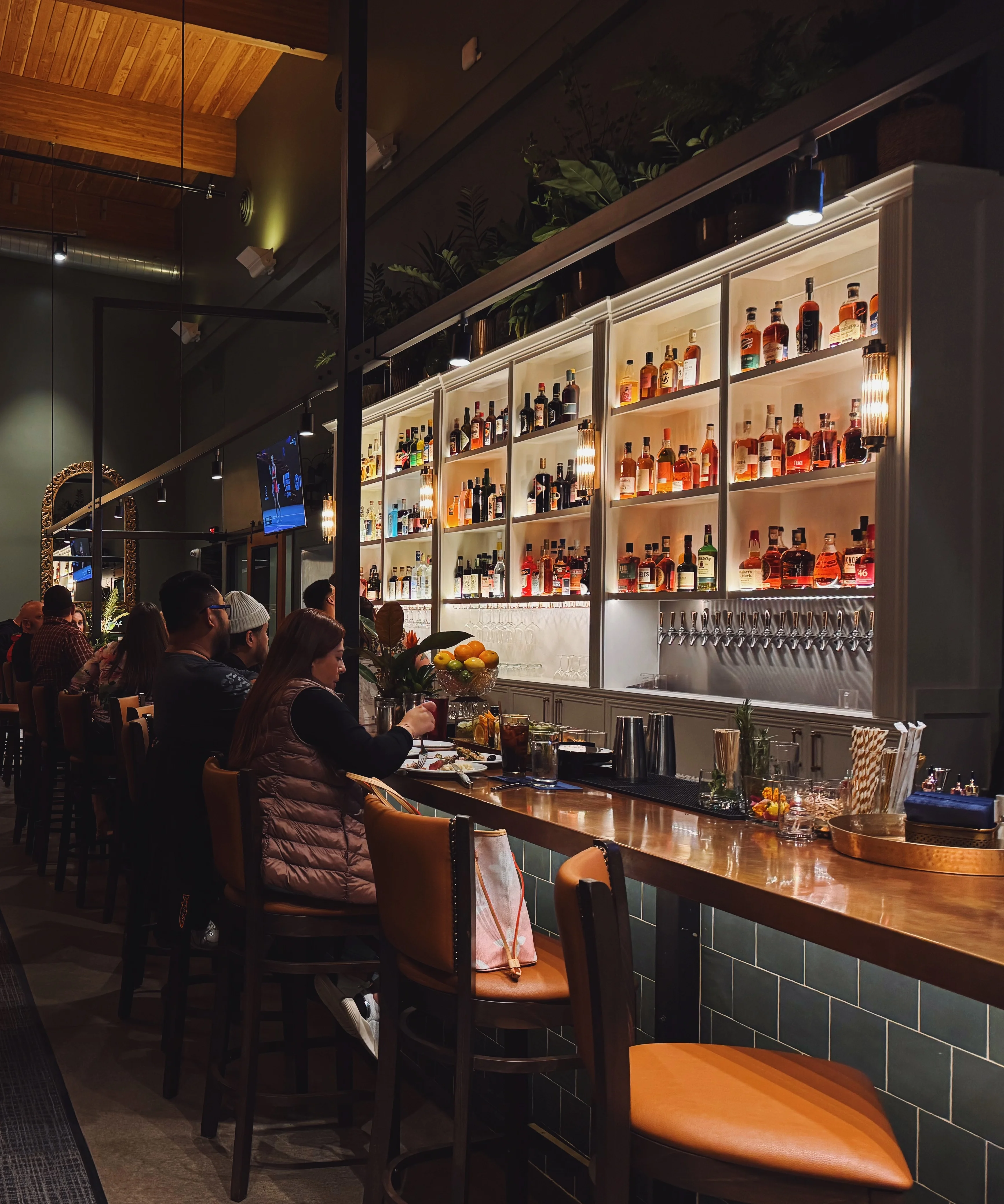 Cozy restaurant interior with elegant lighting and a stylish bar