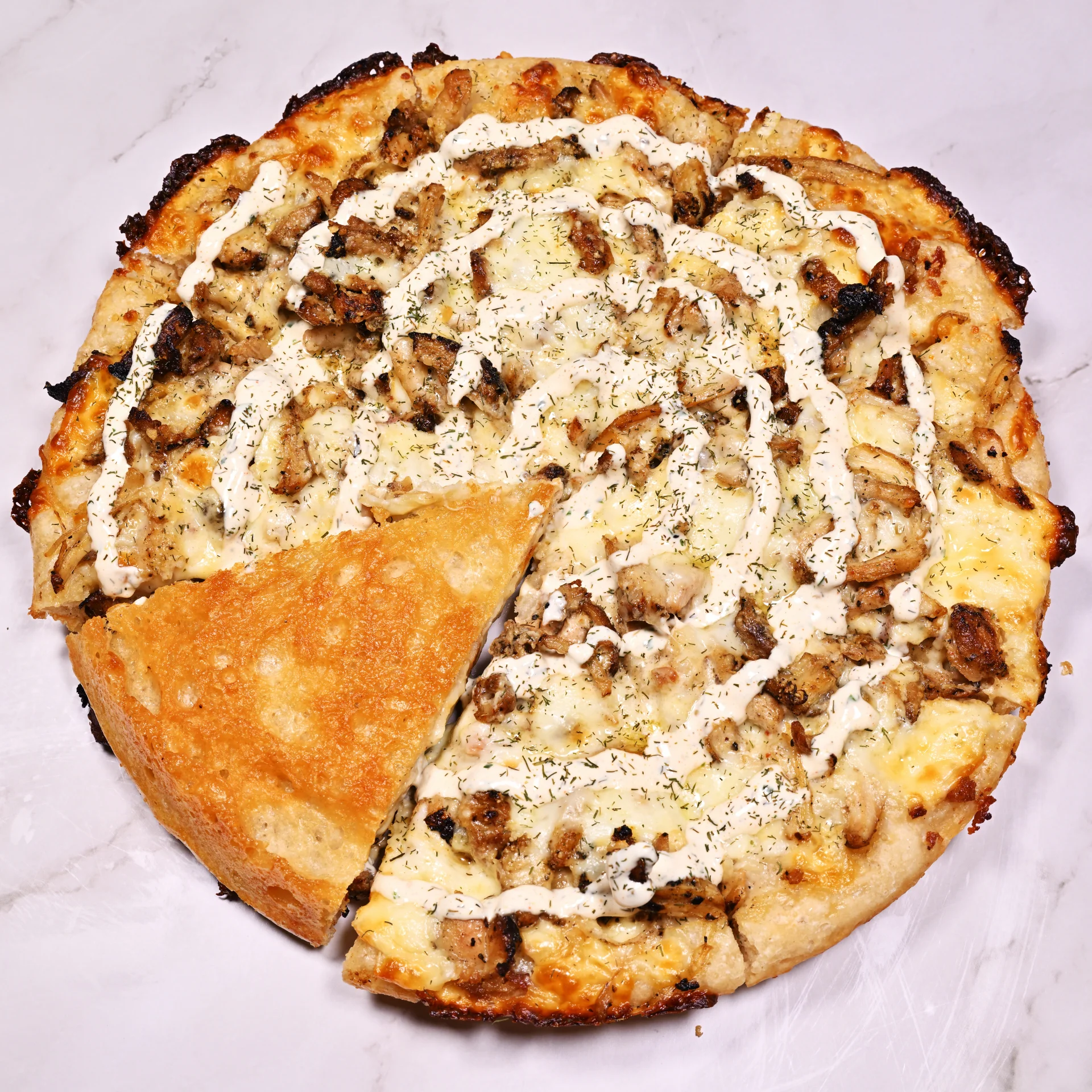 "The Raven" - Our take on the classic chicken, bacon, ranch pizza.