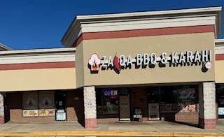 Exterior of Zaqa BBQ & Karahi restaurant with signage