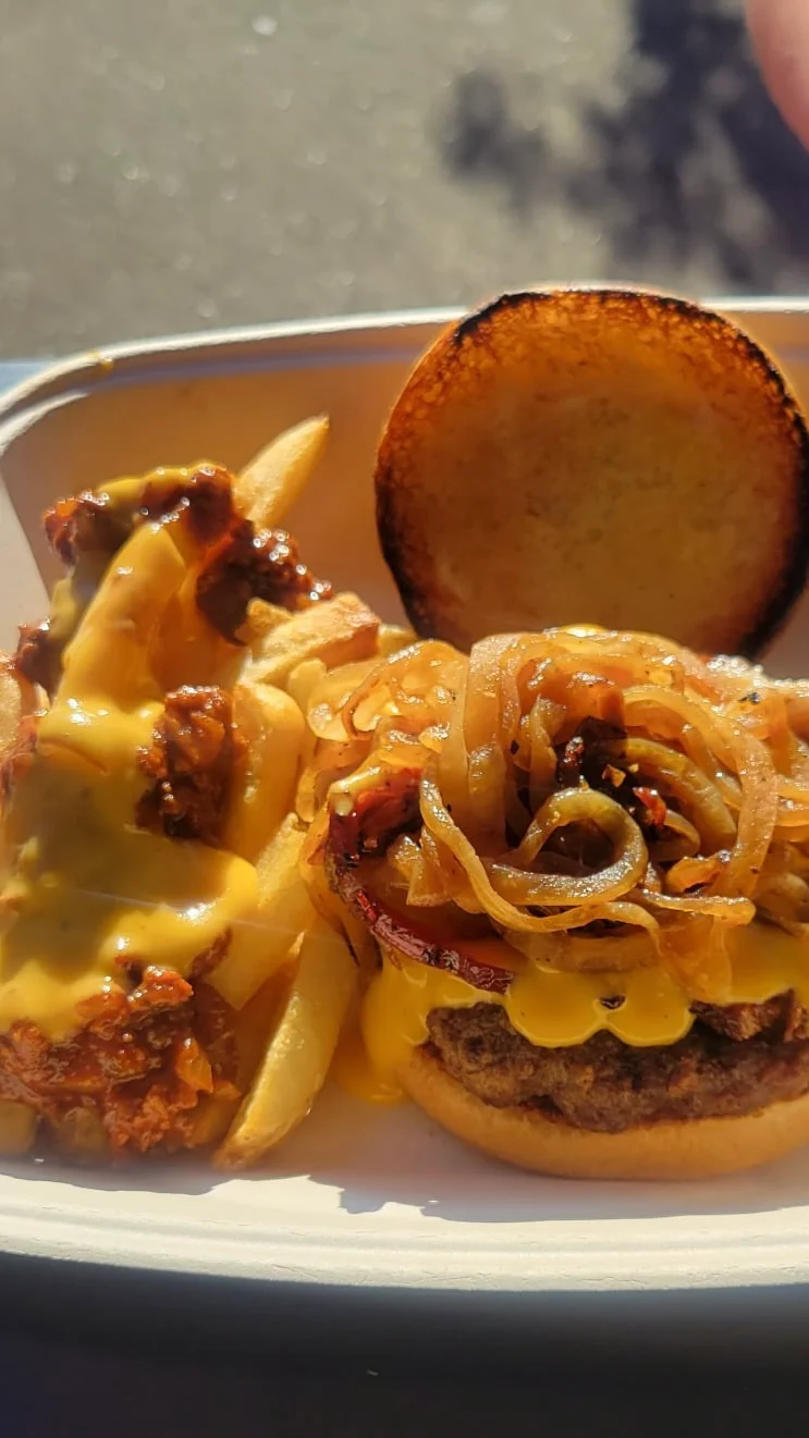 Cheeseburger with caramelized onions and loaded fries