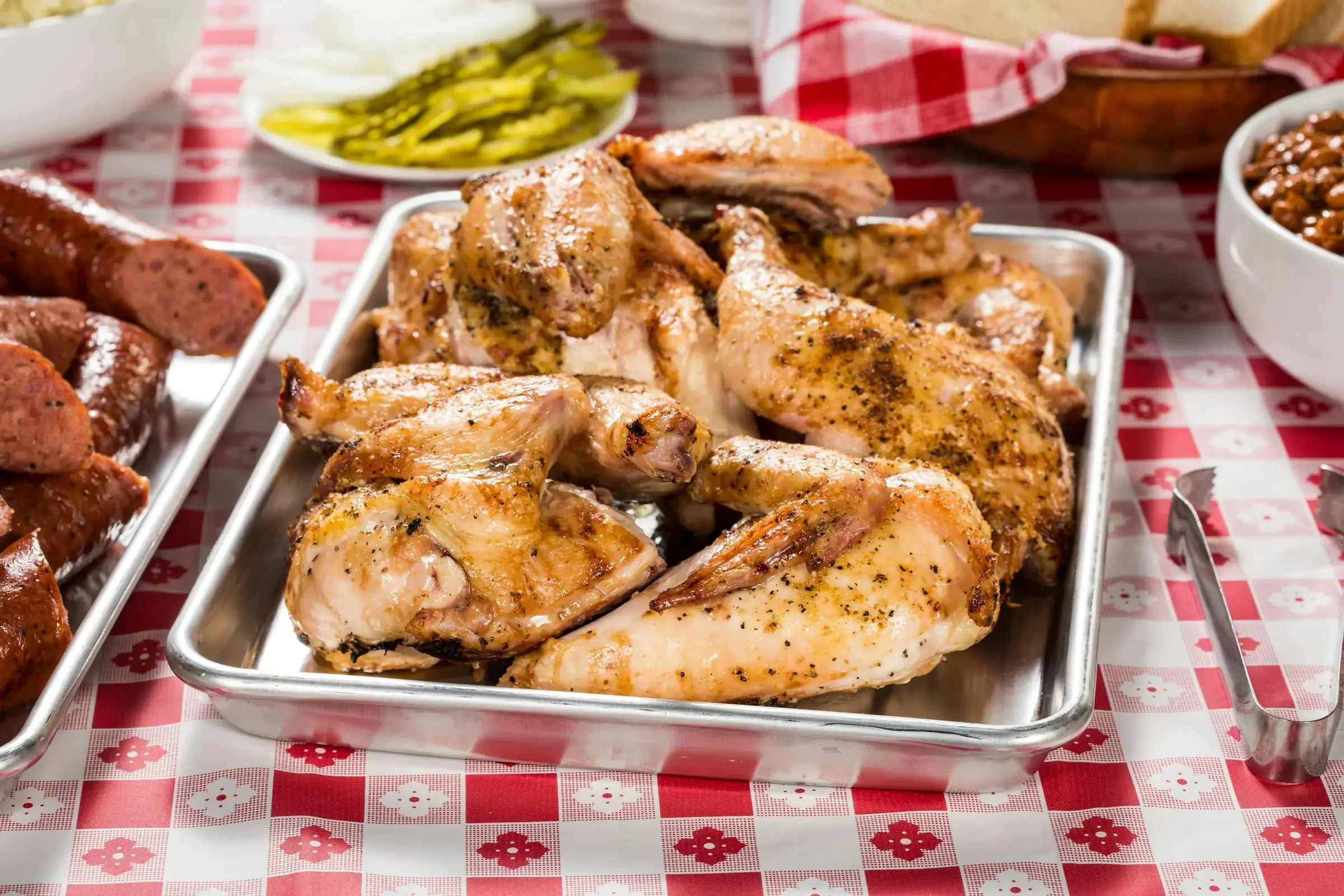 Grilled chicken wings served on a metal tray