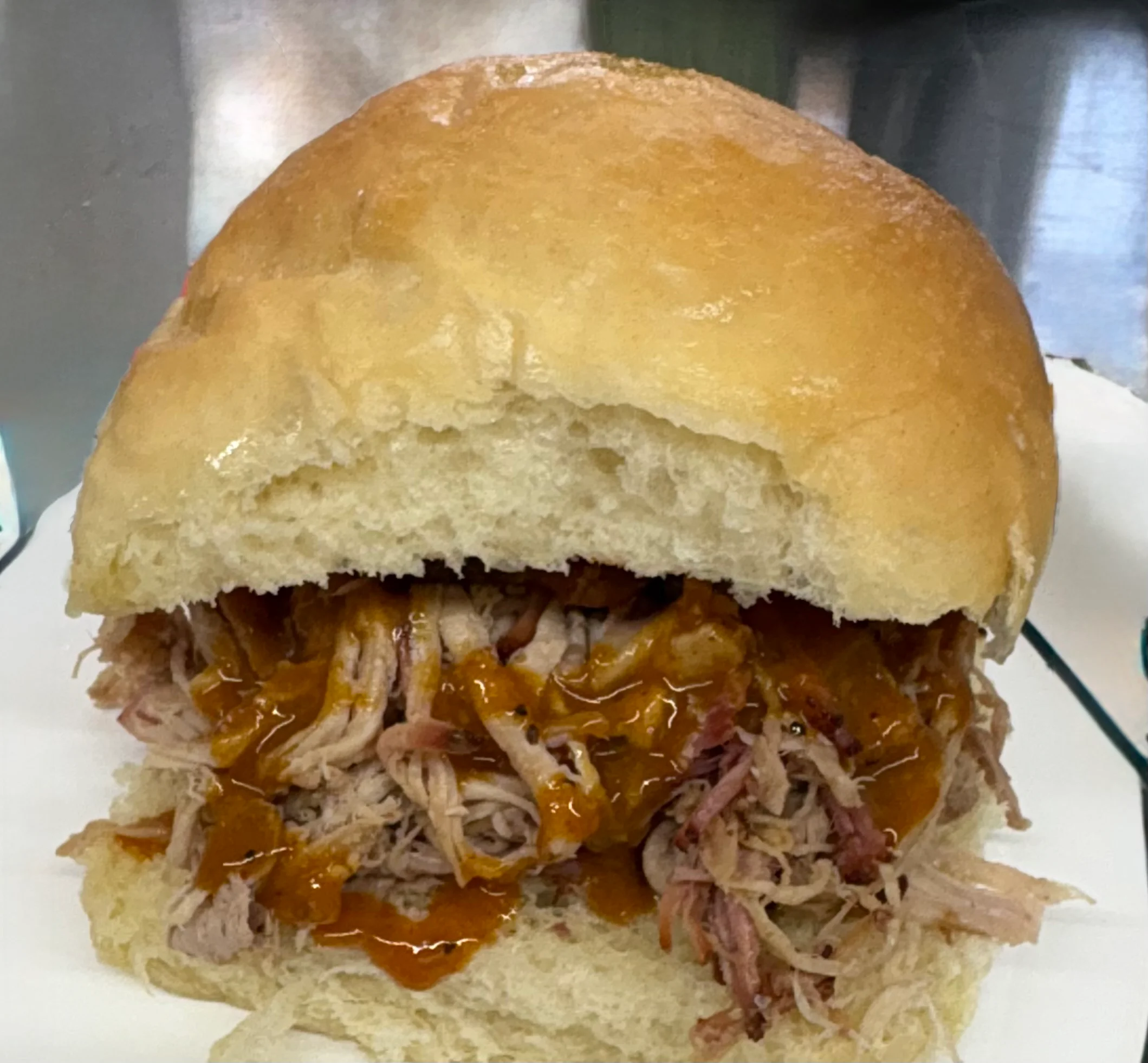 Pulled pork sandwich with barbecue sauce