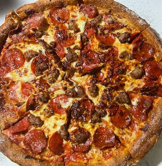 Pepperoni and sausage pizza with a crispy crust
