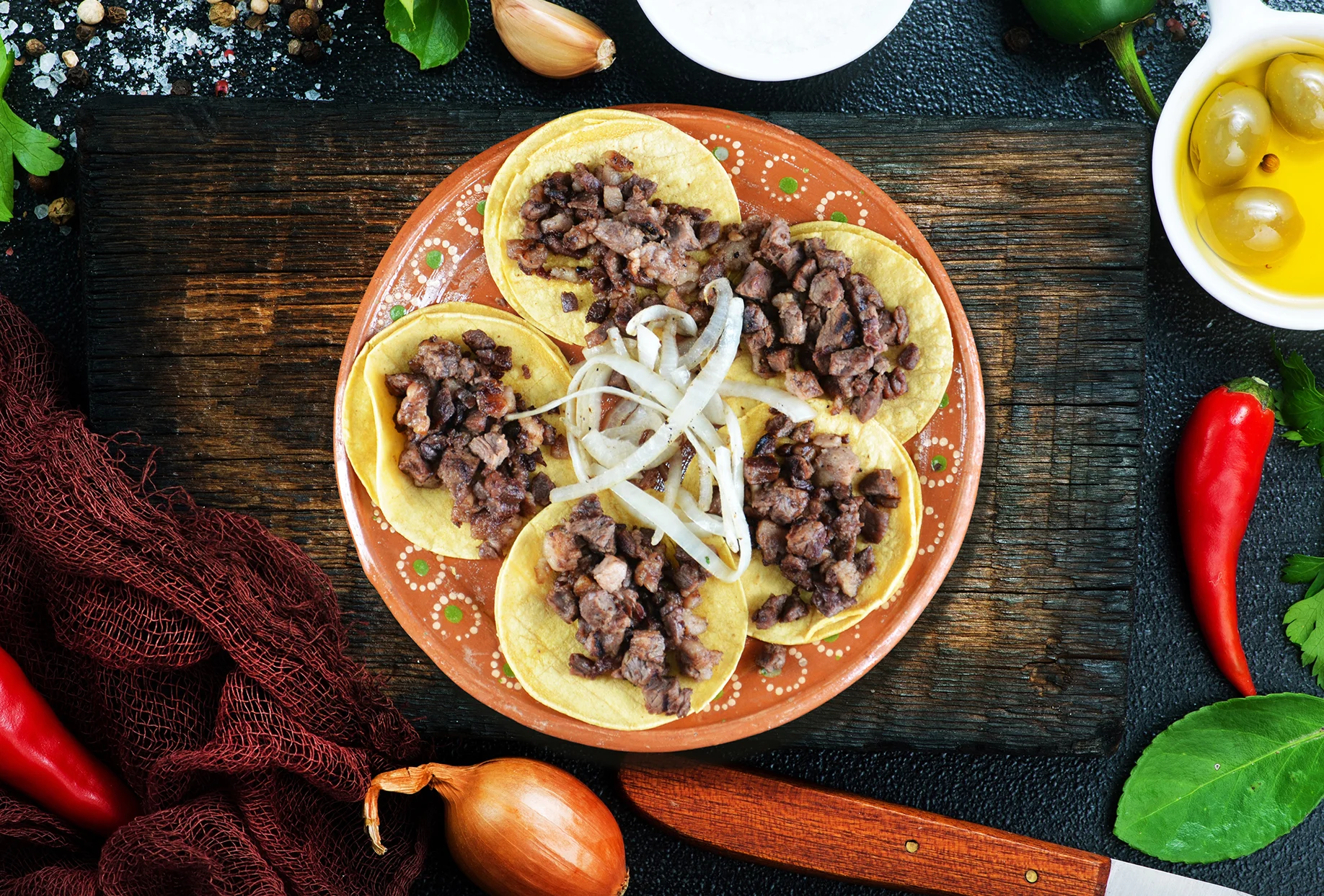 Authentic Mexican tacos al pastor with onions