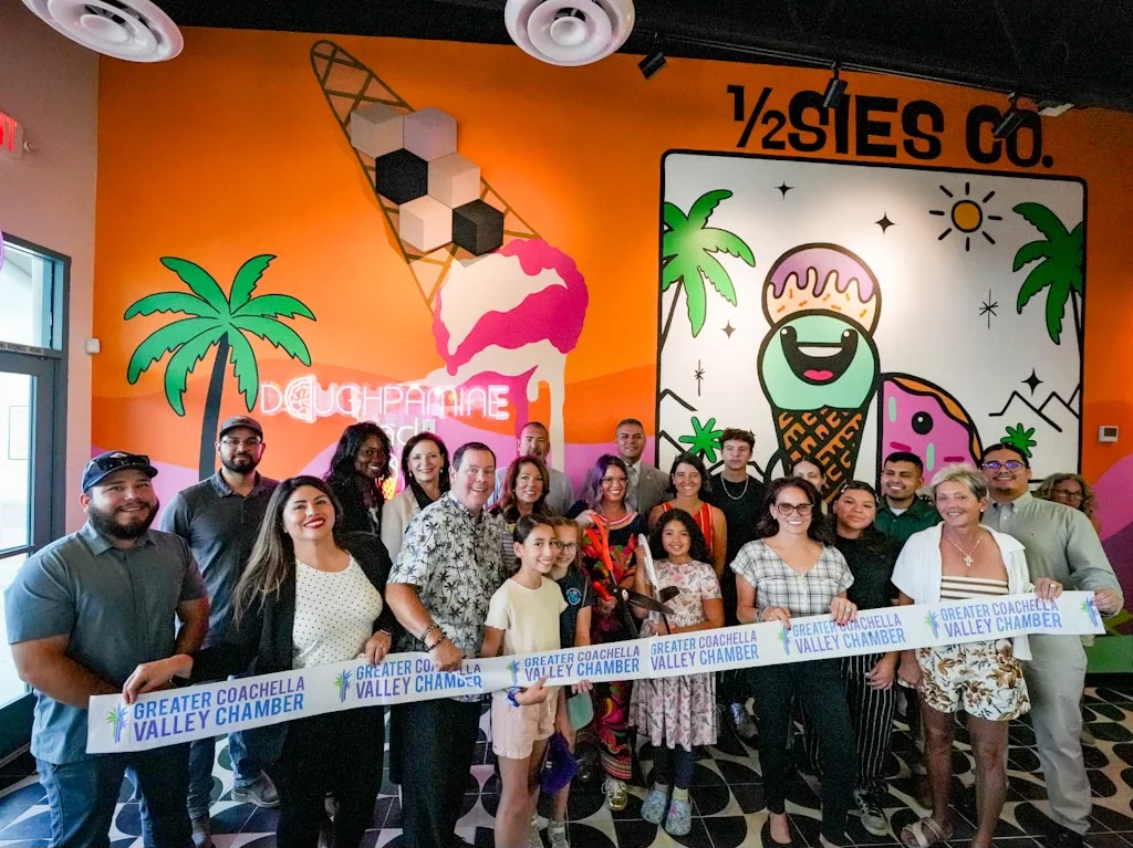 Group celebration at a vibrant restaurant with colorful mural
