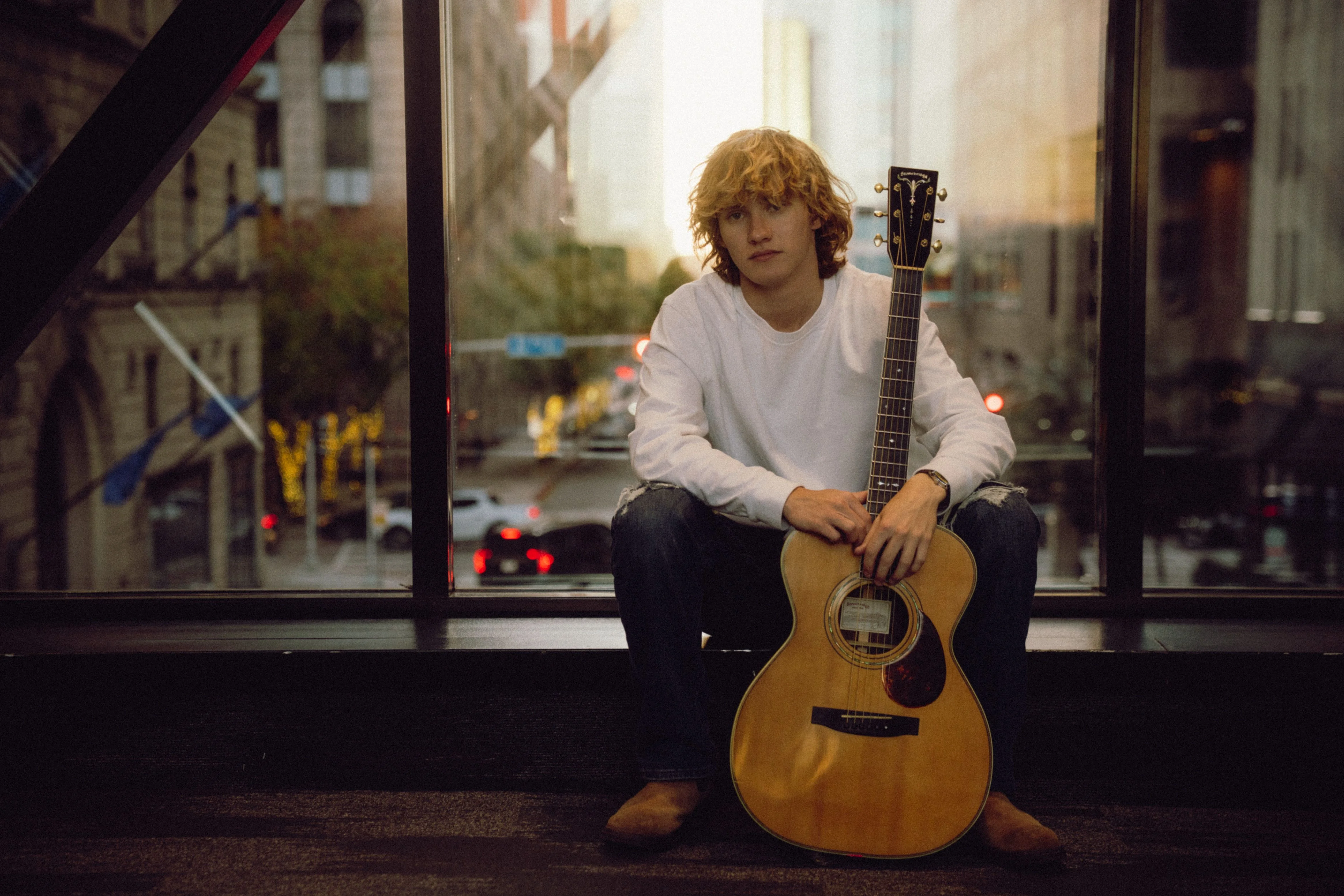 Zayne Browning with his guitar