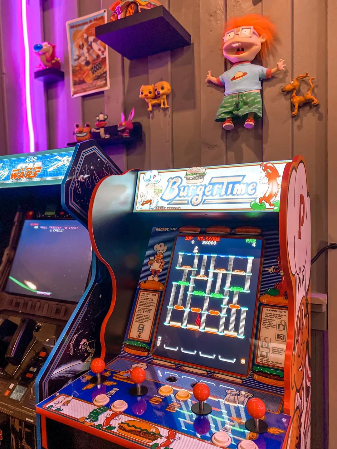 Colorful arcade game setup featuring BurgerTime and Star Wars games