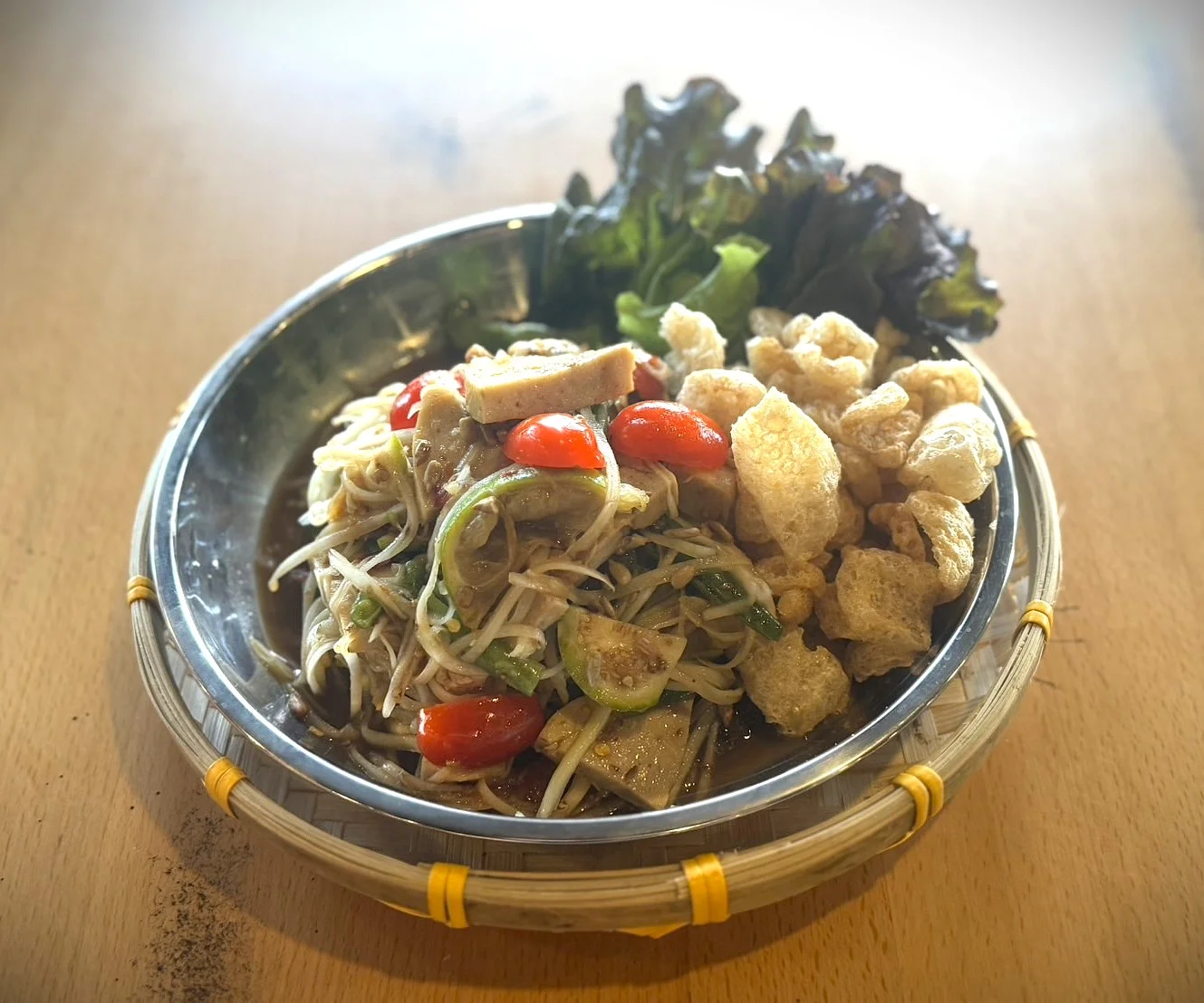 Thai som tam salad with crispy pork rinds