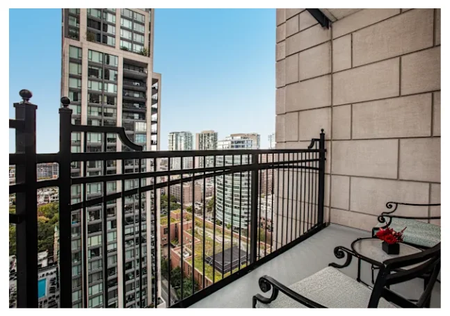 Balcony view of a modern city skyline with seating