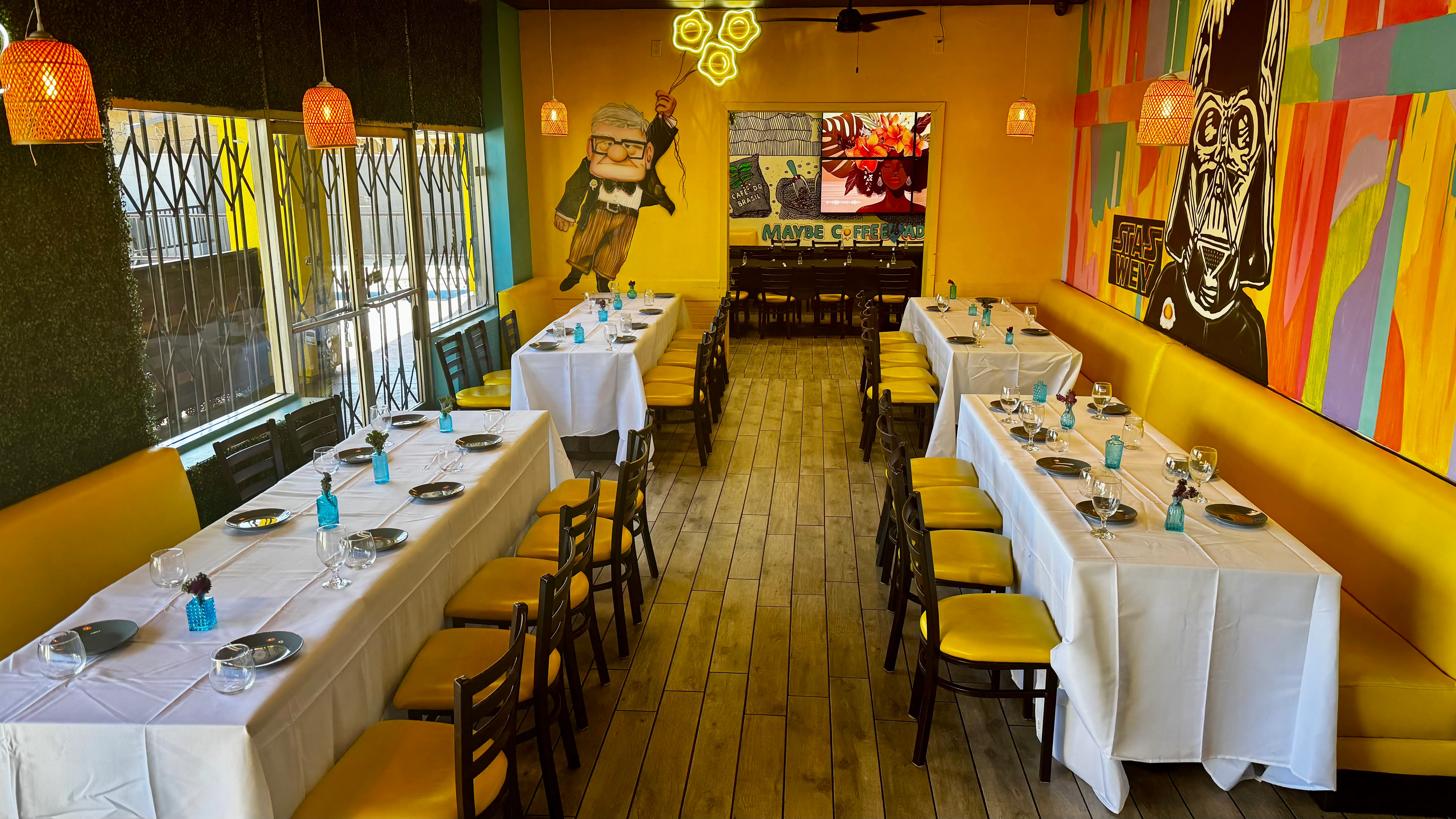 Vibrant restaurant interior with colorful decor and tables set for dining