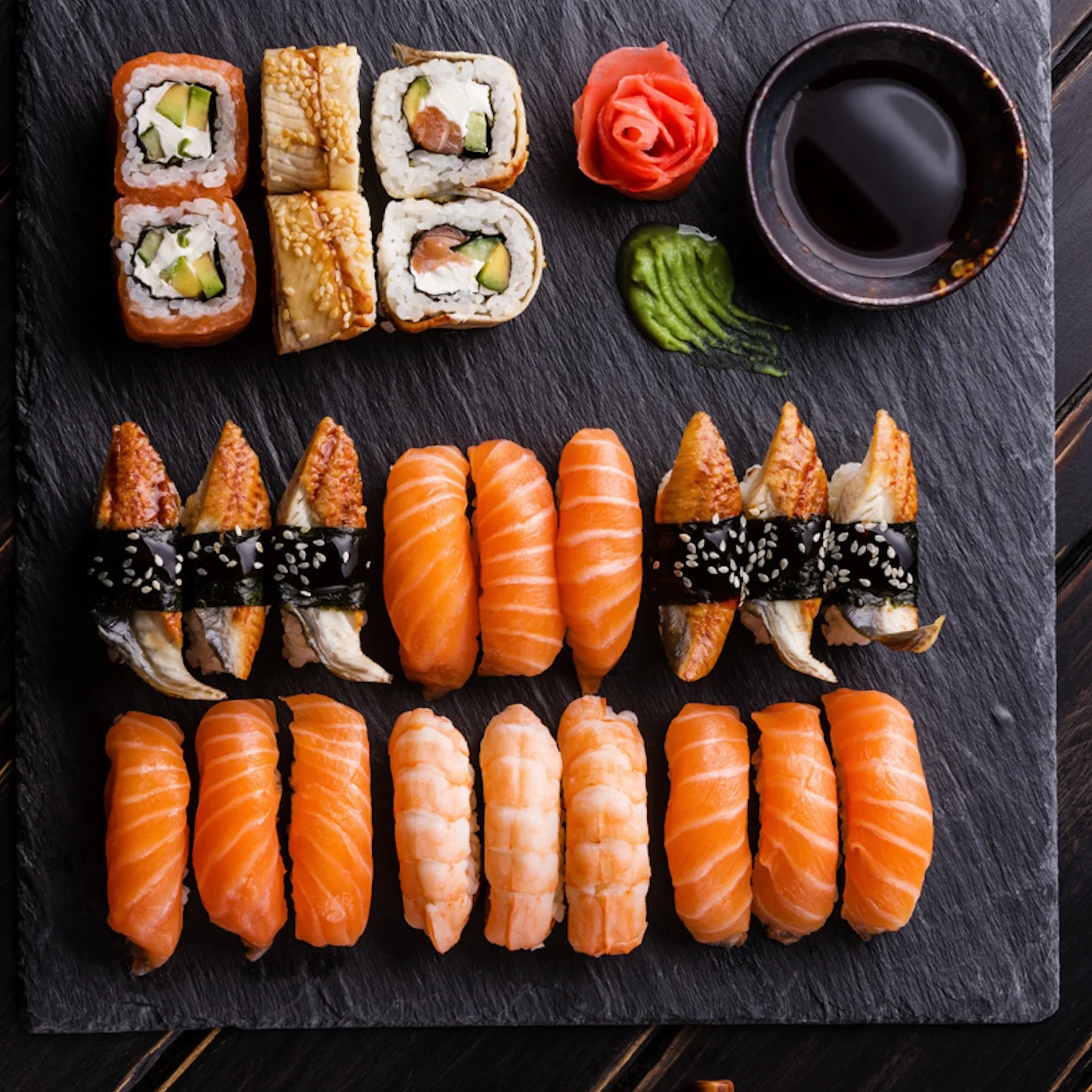 Assorted Japanese sushi platter with soy sauce and garnishes