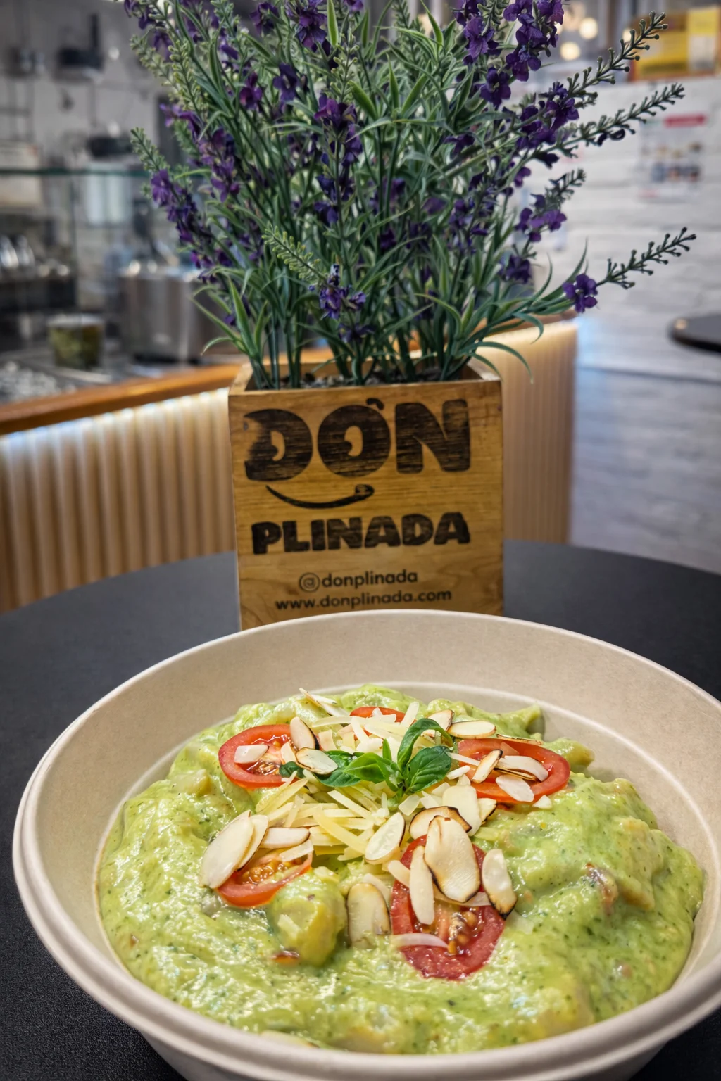 Creamy avocado gnocchi in a rustic bowl