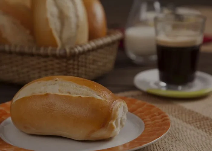 Freshly baked Brazilian pão francês on a plate